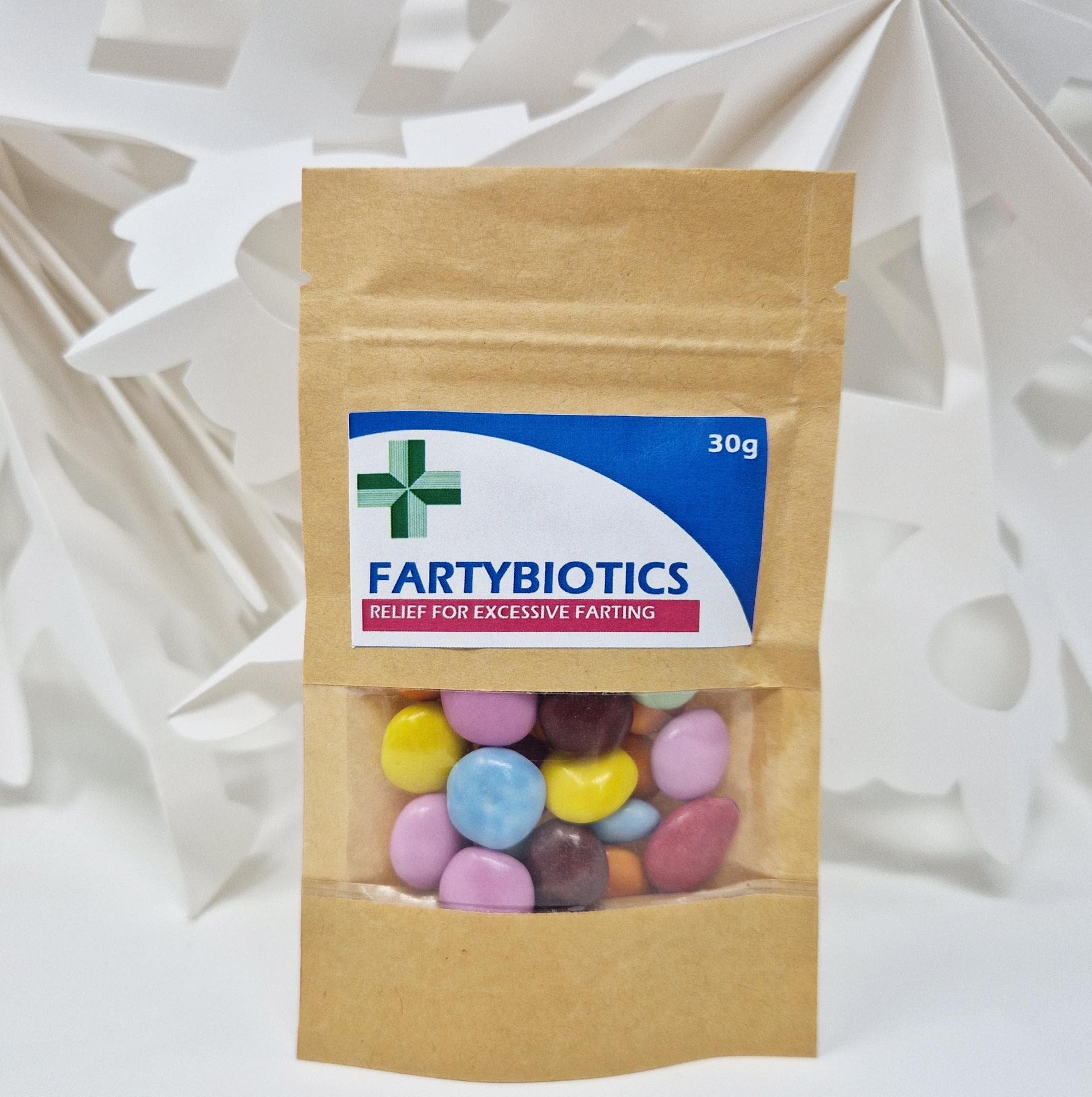 Funny novelty sweet bag labeled 'Anti-Farting & Anti-Moaning Old Git Pills' – a hilarious gag gift featuring a bold, cheeky design. Includes approx. 35g of colourful Smarties in the pre-filled option, or choose an empty bag to fill with your own treats. Perfect for birthdays, retirements, or any fun occasion. A lighthearted chocolate joke gift guaranteed to bring laughs to friends and family of all ages