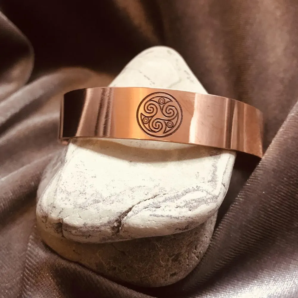 Handmade pure copper cuff bracelet featuring the ancient Celtic Triskelion triple spiral symbol.
