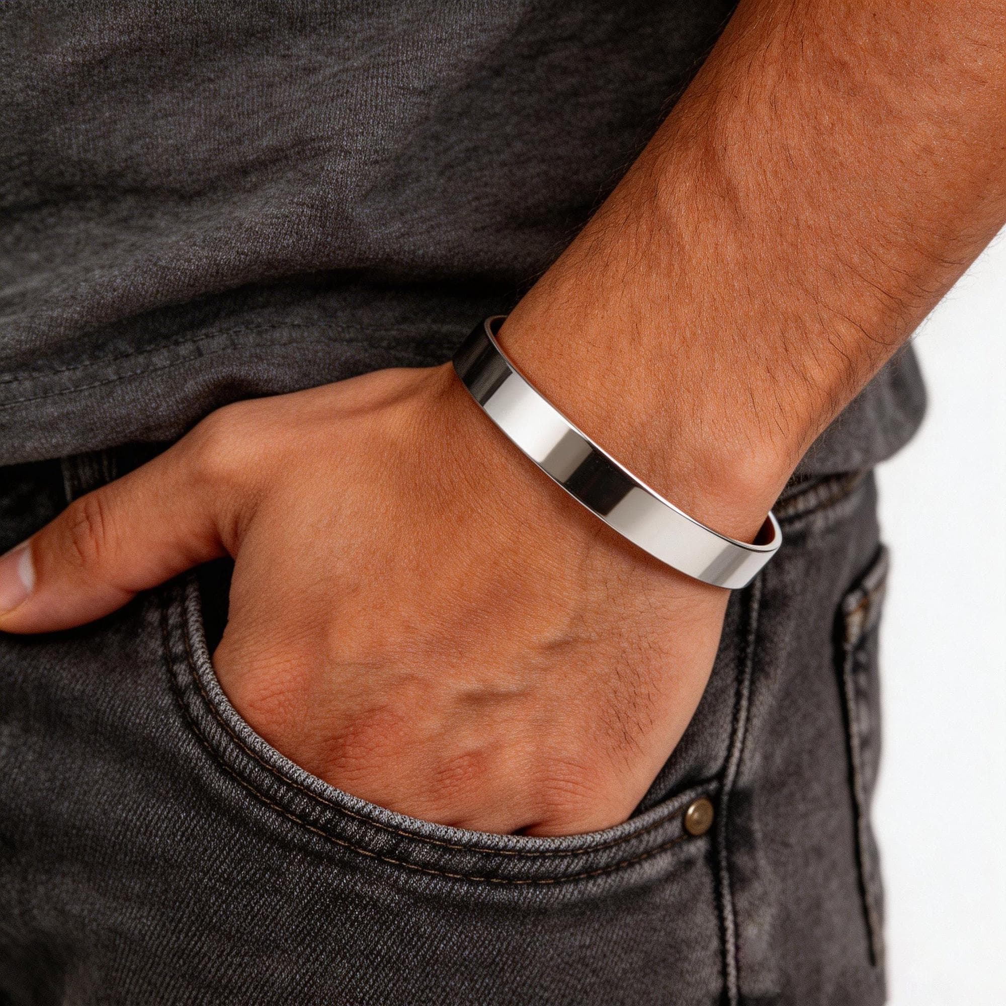 Male model wearing the 10mm silver Islamic protection bracelet, showcasing the sleek minimalist exterior and comfortable adjustable fit on the wrist.
