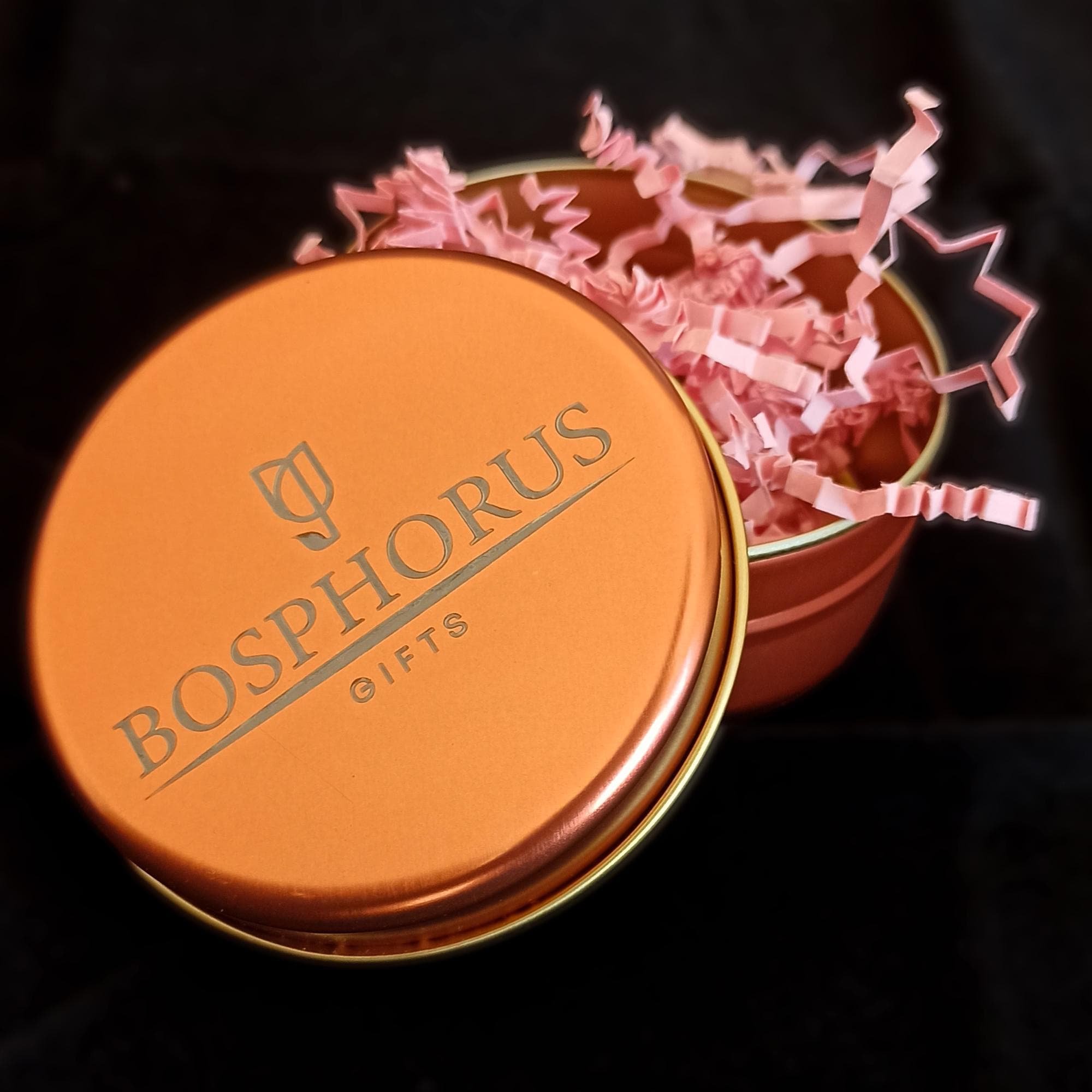 Orange branded elegant tin gift box with Bosphorus Gifts logo, filled with shredded paper packaging