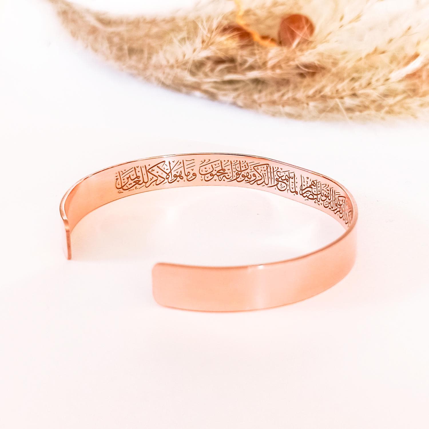Adjustable pure copper cuff bracelet featuring Surah Al-Qalam Nazar protection verse.