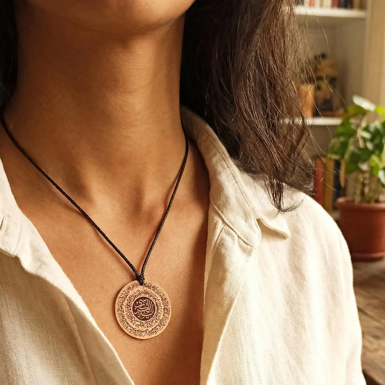 Ayatal Kursi Copper Pendant Model Look, Pure copper spiritual pendant worn on neck highlighting skin contact.