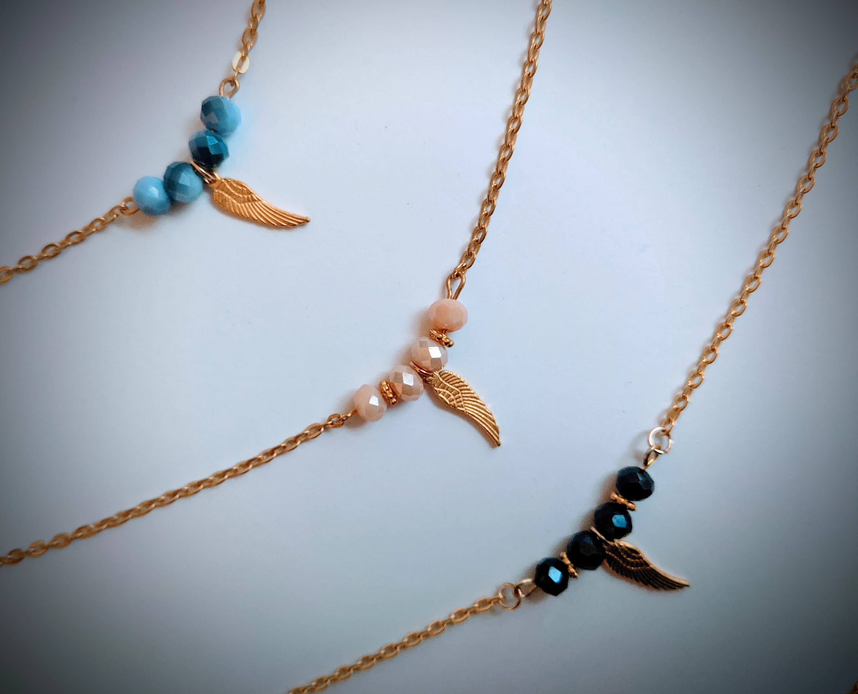 Crystal Beaded Necklace with Gold Wing Charm