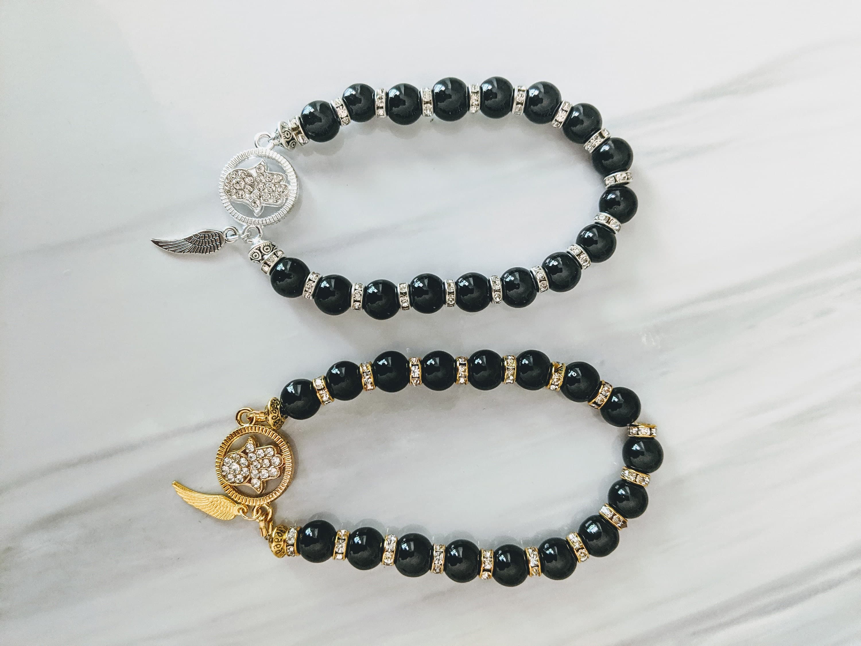 Black Bead Hamsa Bracelet: Rhinestone Spacers, Angel Wing Charm