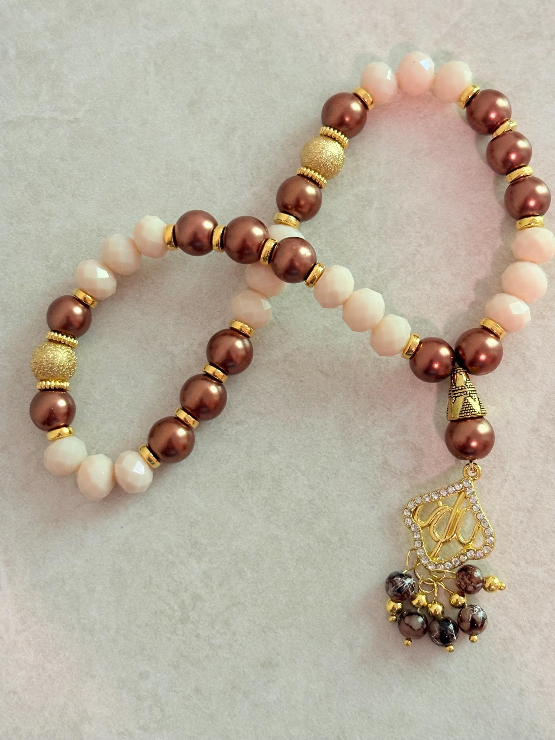 33 Brown pearls and opaque beige crystals