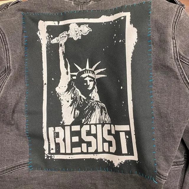 Anti-authority patch with Liberty graphic and resistance message.