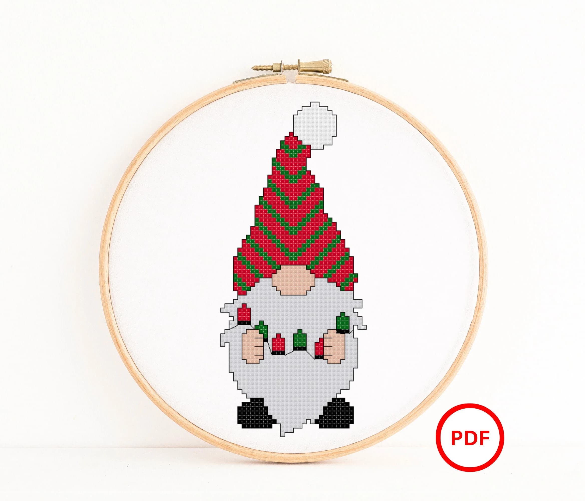 Christmas Gnome holding a Christmas Lights Cross Stitch Pattern