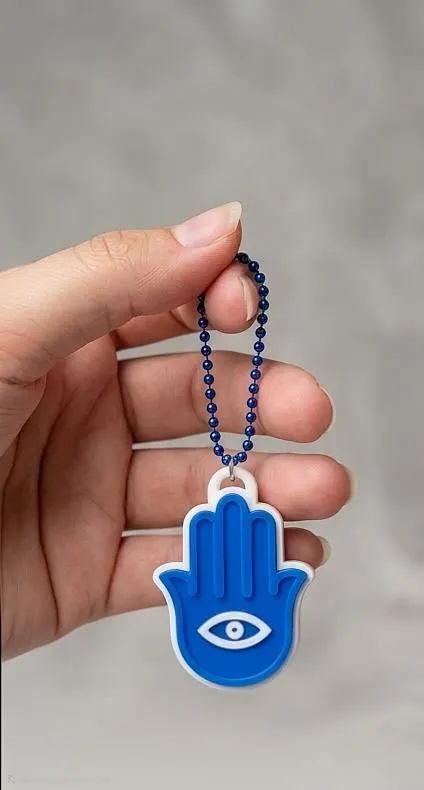 Islamic-inspired Hamsa Hand clicker toy keychain with satisfying tactile clicks and intricate decorative details.