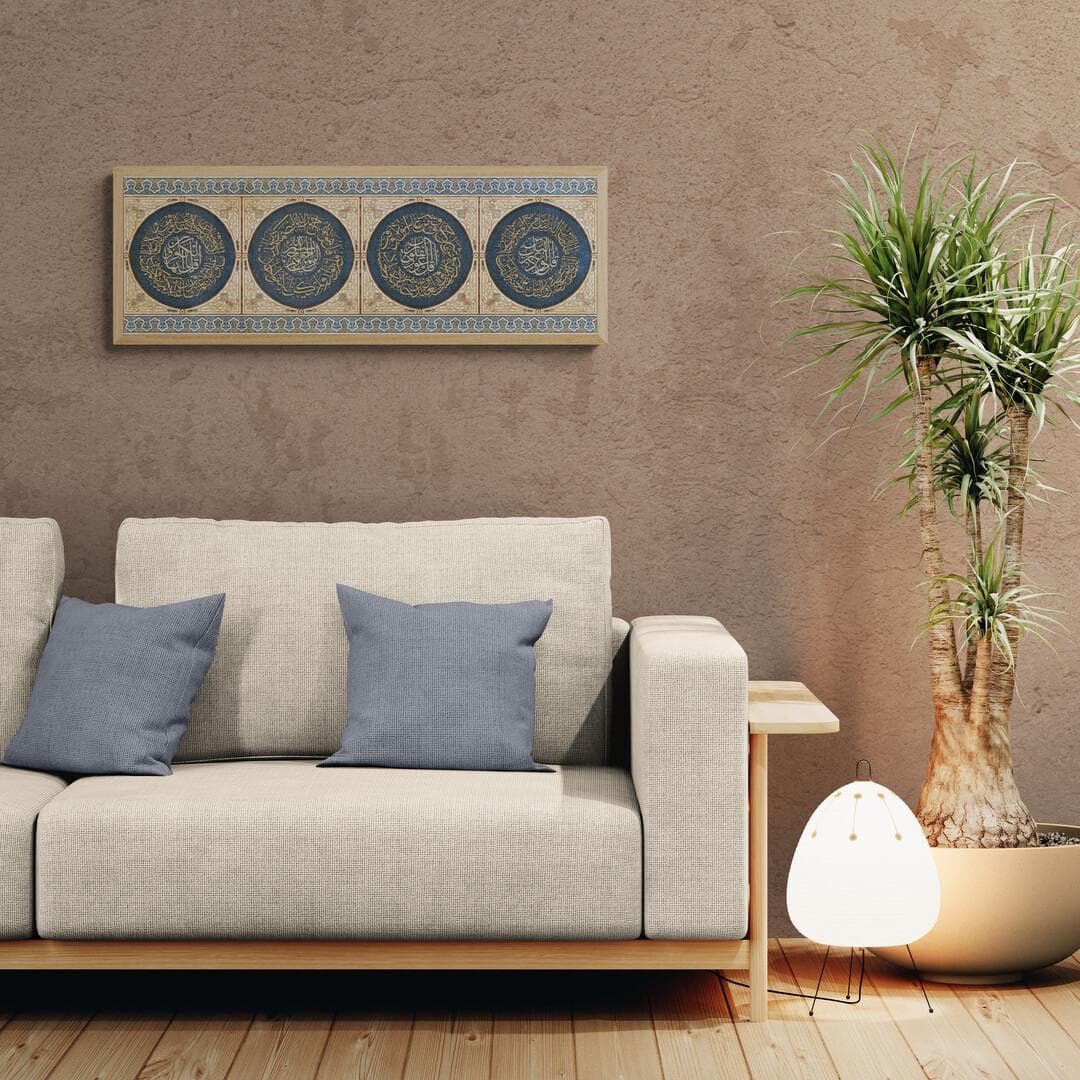 Four Qul surahs in circular calligraphy, navy background, gold script, wood‑tone frame.