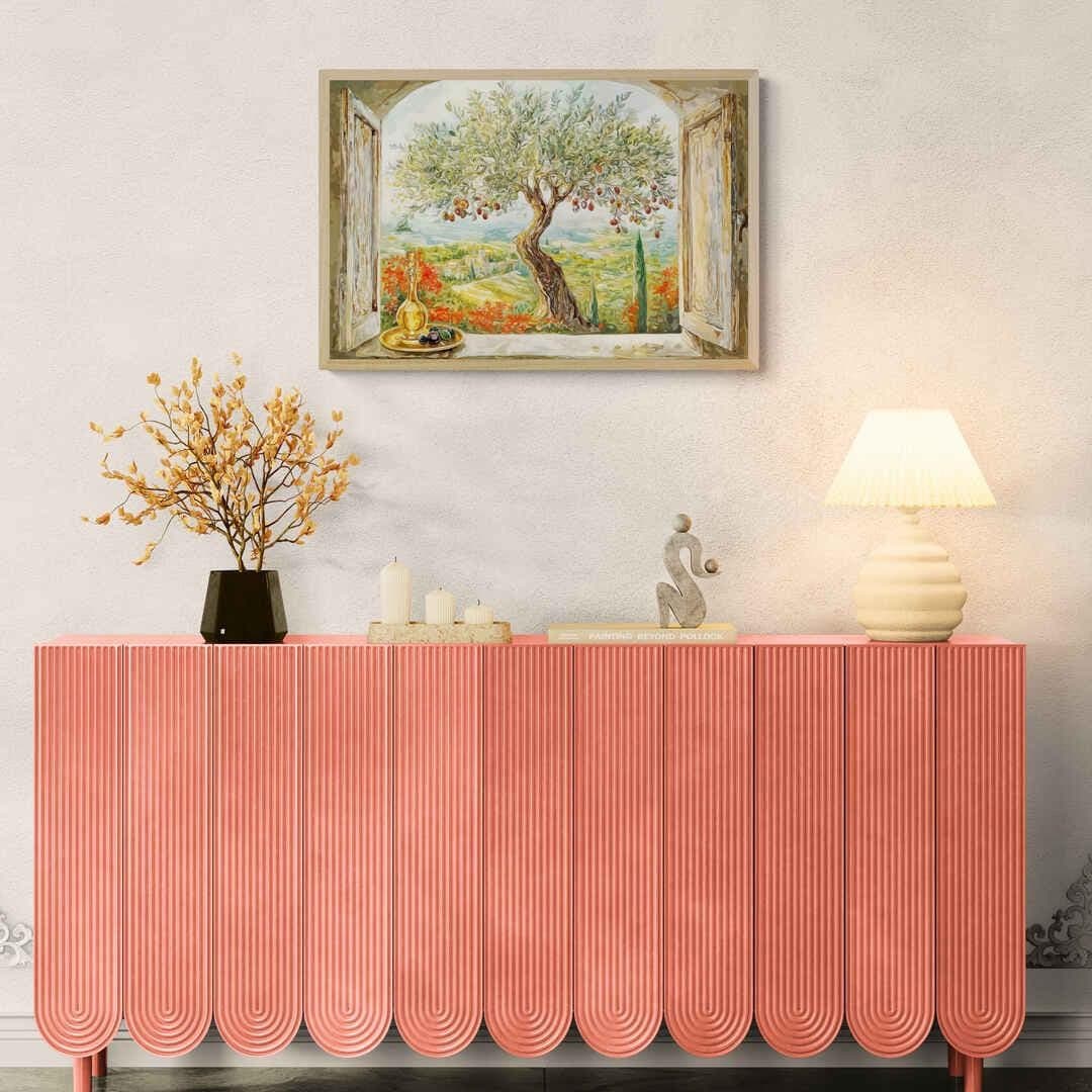 Earth-toned arched window frame overlooking peaceful landscape with cypress trees and red flowers.