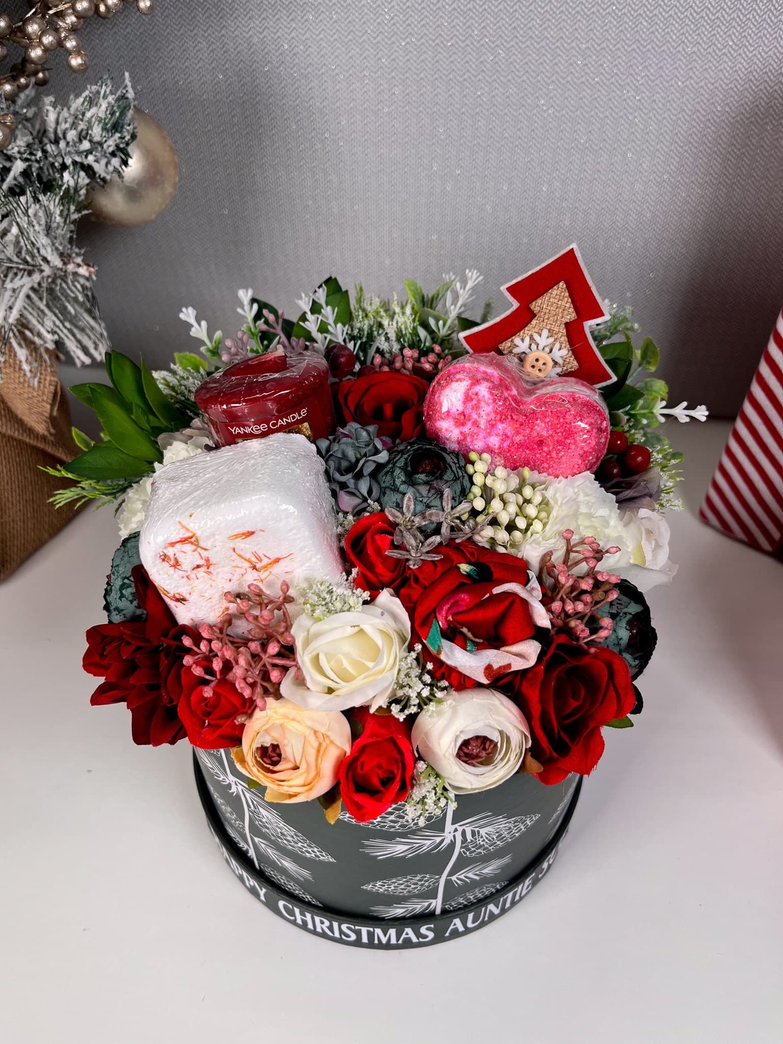 Personalised Christmas Flower Bouquet with pamper items inside. IncludingBath bomb, shower steamer, yankee candle votive and satin headband