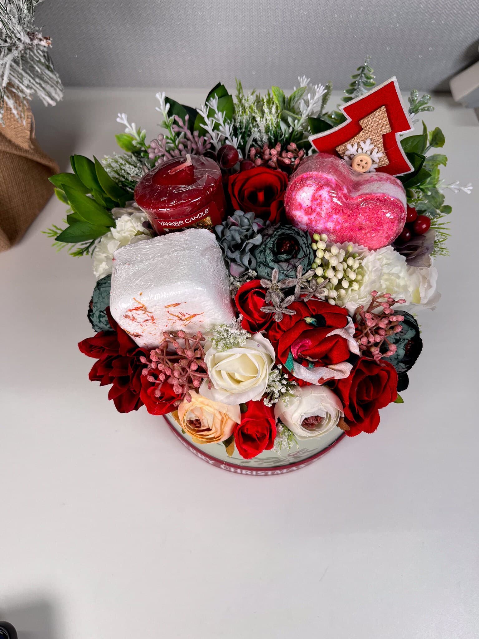 Personalised Christmas Flower Bouquet with pamper items inside. IncludingBath bomb, shower steamer, yankee candle votive and satin headband