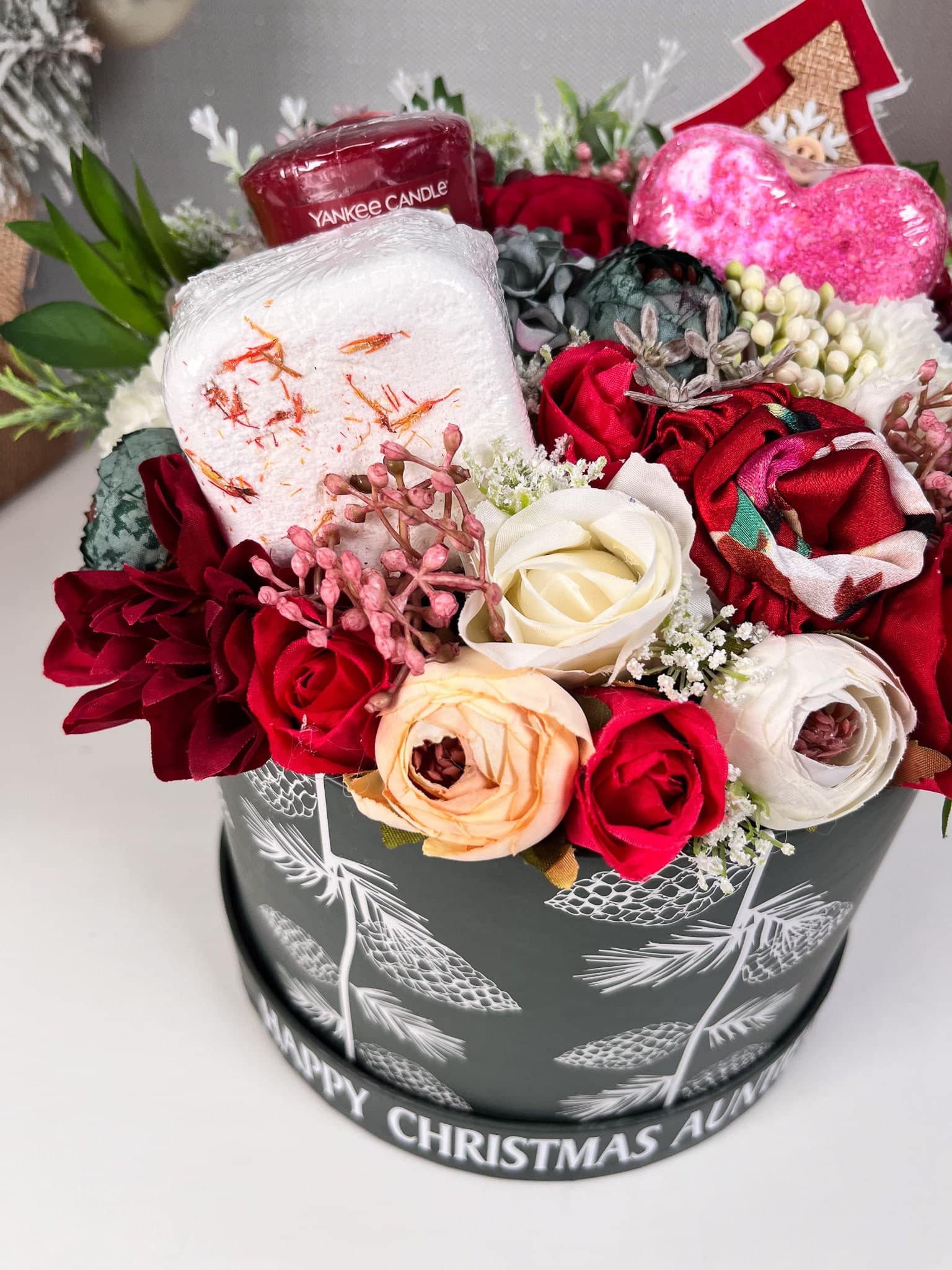Personalised Christmas Flower Bouquet with pamper items inside. IncludingBath bomb, shower steamer, yankee candle votive and satin headband