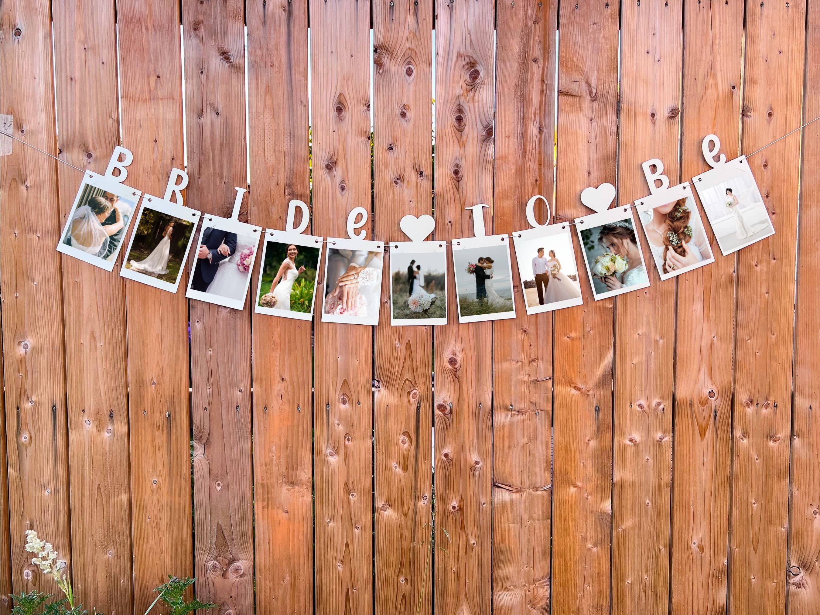 This is a card stock banner that spells out “bride to be”. This banner contains slits where photos of the bride can easily be inserted. It comes prestrung.