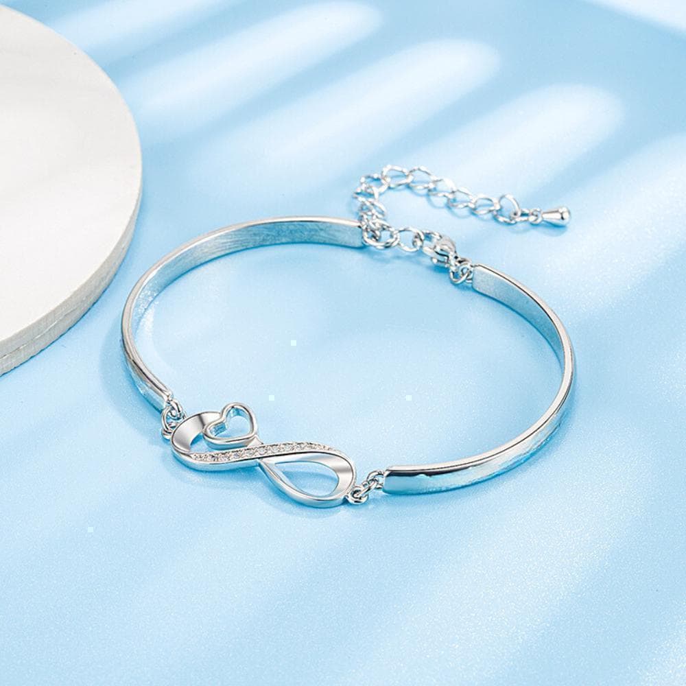 a close up of a bracelet on a table