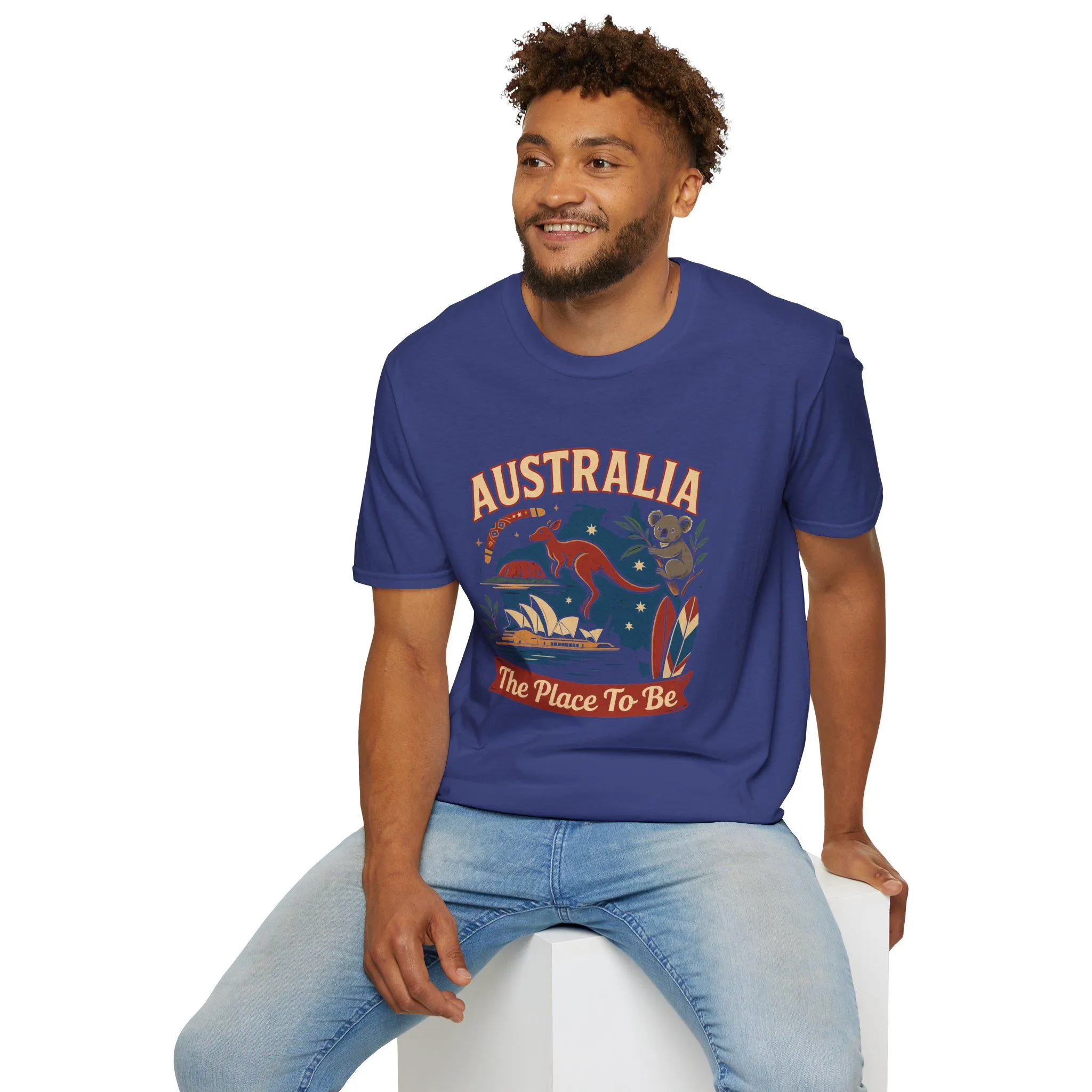 AUSTRALIA – The Place To Be!, A colorful and attractive Aussie T-shirt, from a PROUD Australian.
The bold, stylized lettering of "AUSTRALIA, The Place To Be" is surrounded by beloved Aussie icons. From the hopping kangaroo and cuddly koala 🐨 to the majestic Sydney Opera House, the legendary Uluru, surfboards by the beach 🏄♀️, eucalyptus leaves, and the trusty boomerang, making it a perfect Aussie Gift.
This beautiful t-shirt is available in multiple attractive colors and sizes from XS to 5XL.