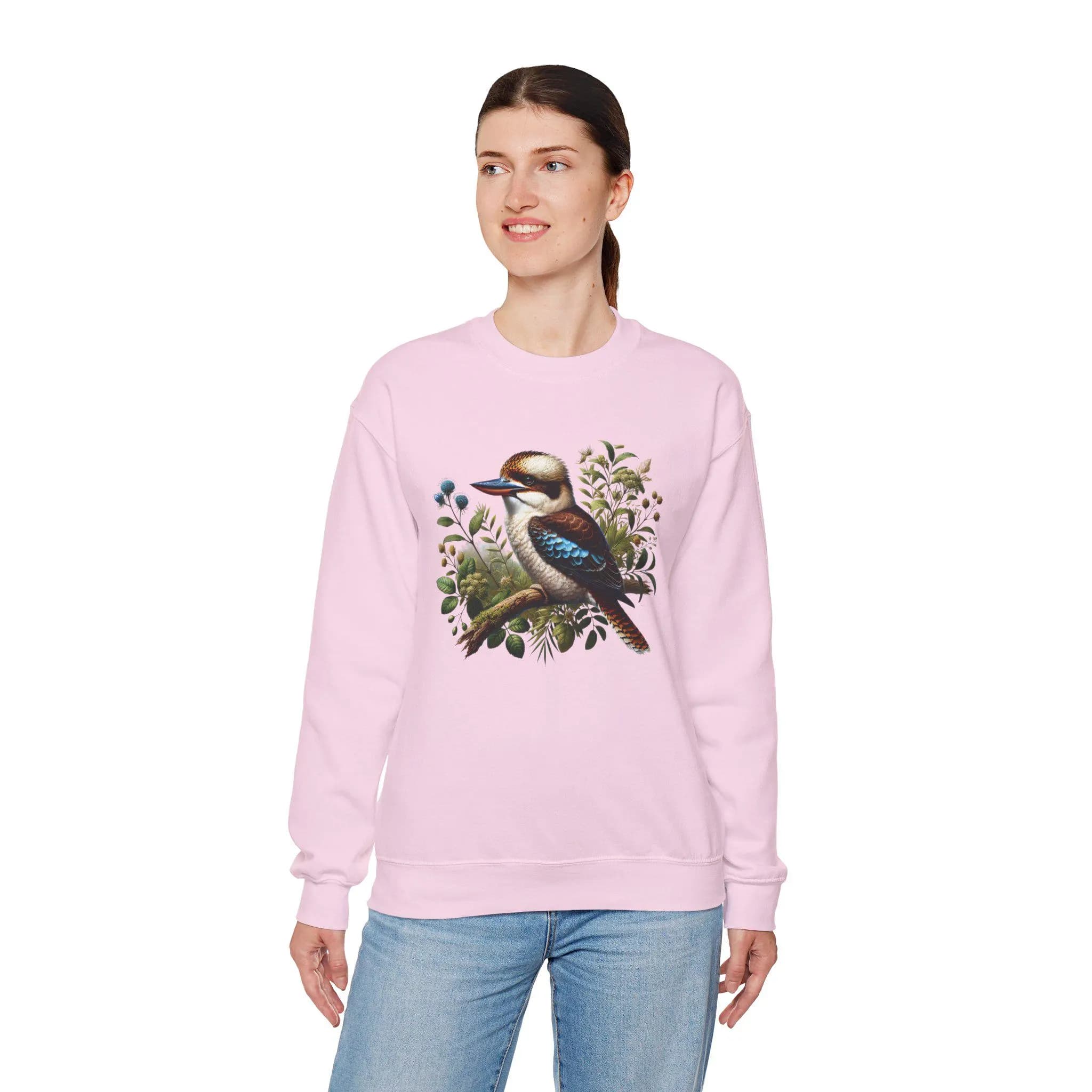 Celebrate the beauty and charm of Australia's iconic wildlife with this delightful Gildan 18000 sweatshirt, featuring a cute kookaburra sitting peacefully on a branch. Whether you're an Australian wildlife lover, a nature enthusiast, or someone who appreciates unique bird-themed apparel, this sweatshirt is a charming way to express your love for the natural world.
This Kookaburra shirt is available in multiple attractive colors and sizes from Small to 5XL.