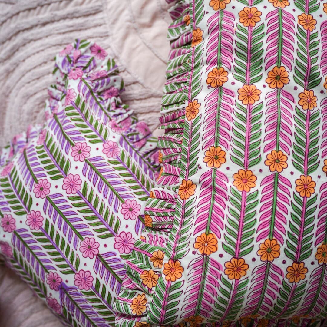 Handcrafted cushion adorned with intricate hand block prints in a lively bohemian style, bursting with an array of vibrant and colorful hues