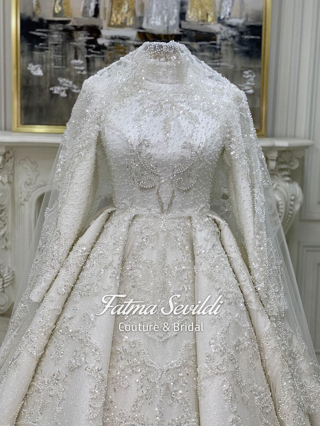 Veiled hijab wedding dress in a modest ballgown silhouette with high neck, long sleeves, and hand-beaded lace sparkle, including a premium lace veil.