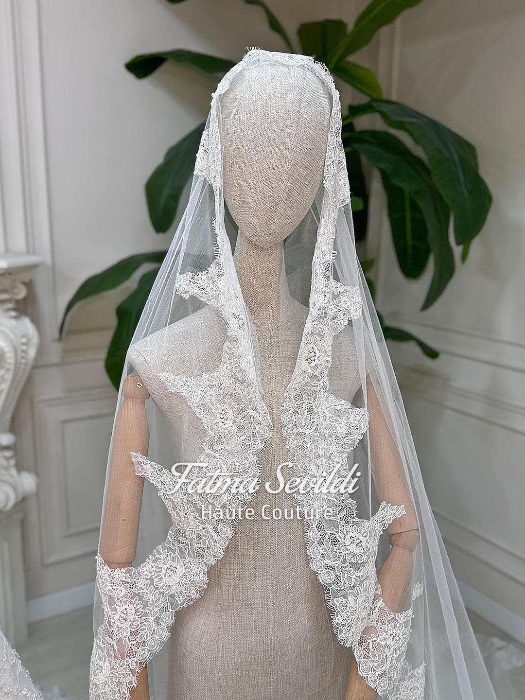 Veiled hijab wedding dress with full beaded lace, long sleeves and an elegant A-line silhouette, custom made for luxury modest bridal coverage. Includes a premium lace veil for a complete Muslim bridal set.