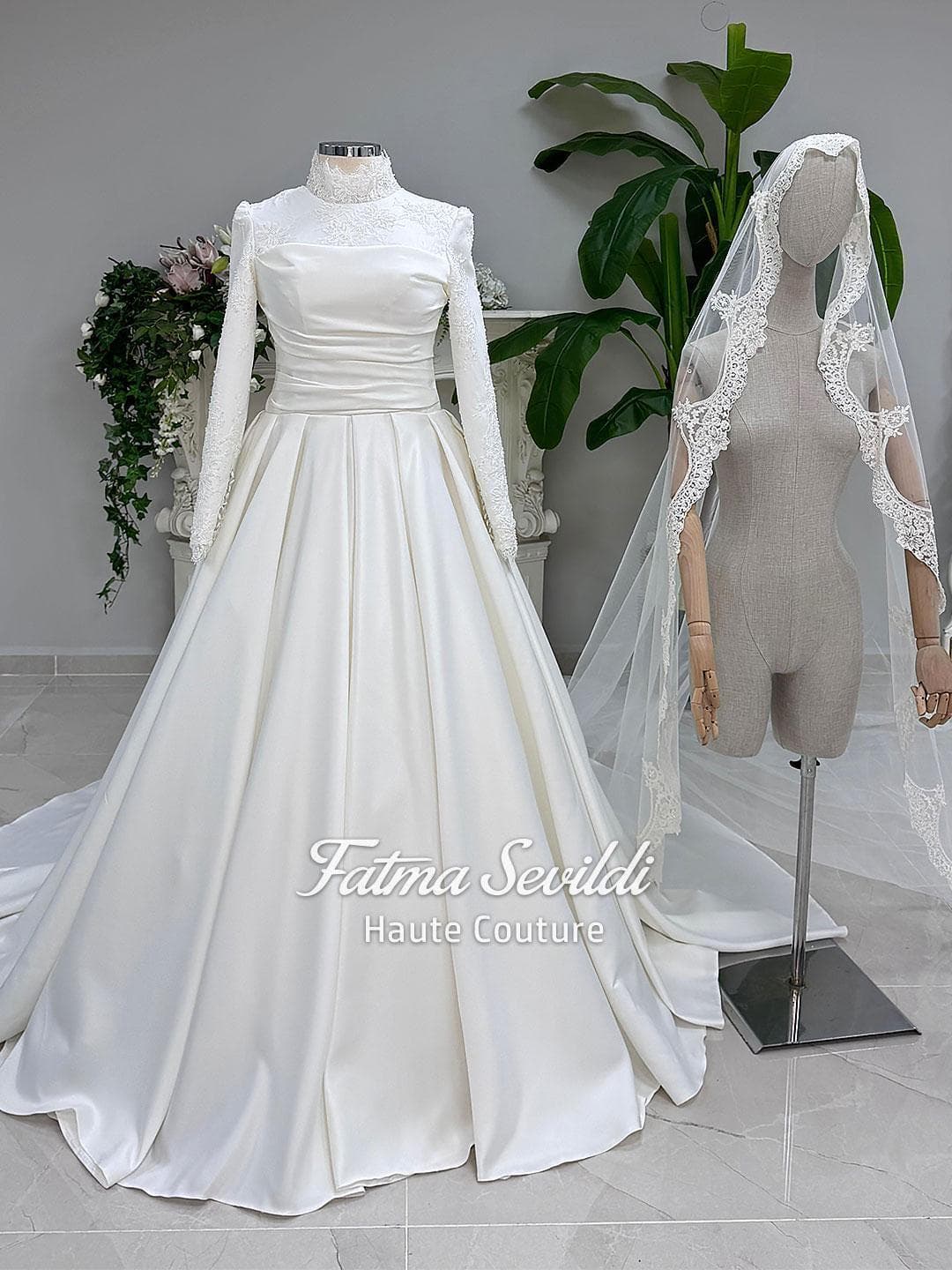 Veiled hijab wedding dress in luminous satin with high neck, long sleeves and an elegant A-line silhouette, custom made for modest bridal coverage. Includes a premium lace-trim veil for a complete Muslim bridal set.