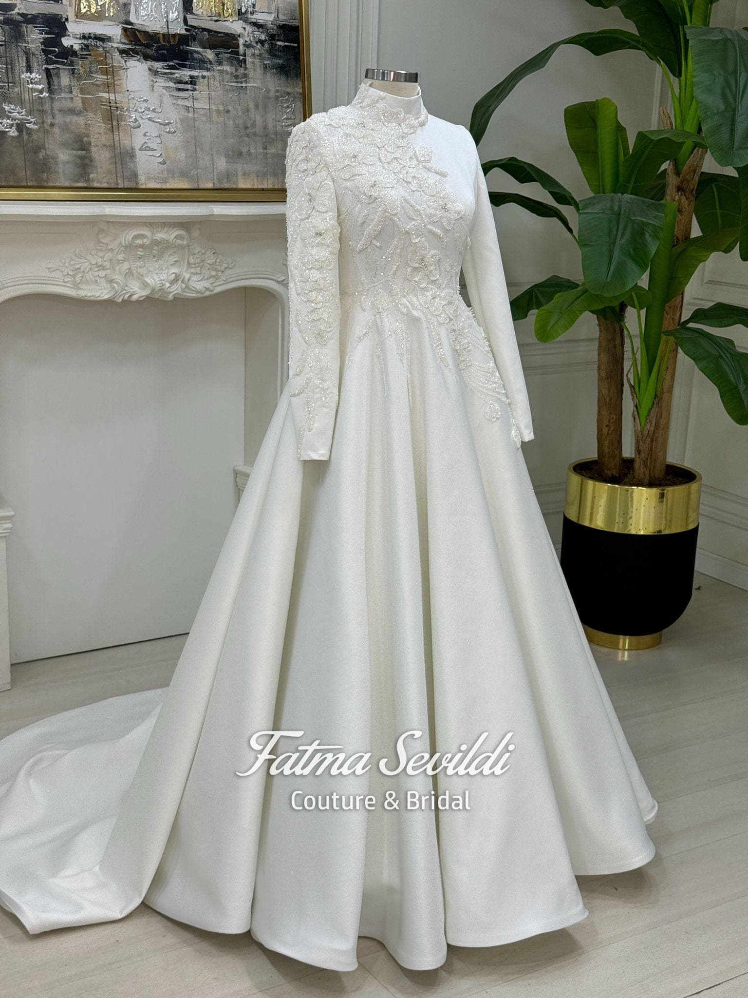 Veiled hijab wedding dress in luminous satin with high neck and long sleeves, custom made with corsetry for a luxury modest ballgown silhouette. Includes a premium lace veil for a complete Muslim bridal set.
