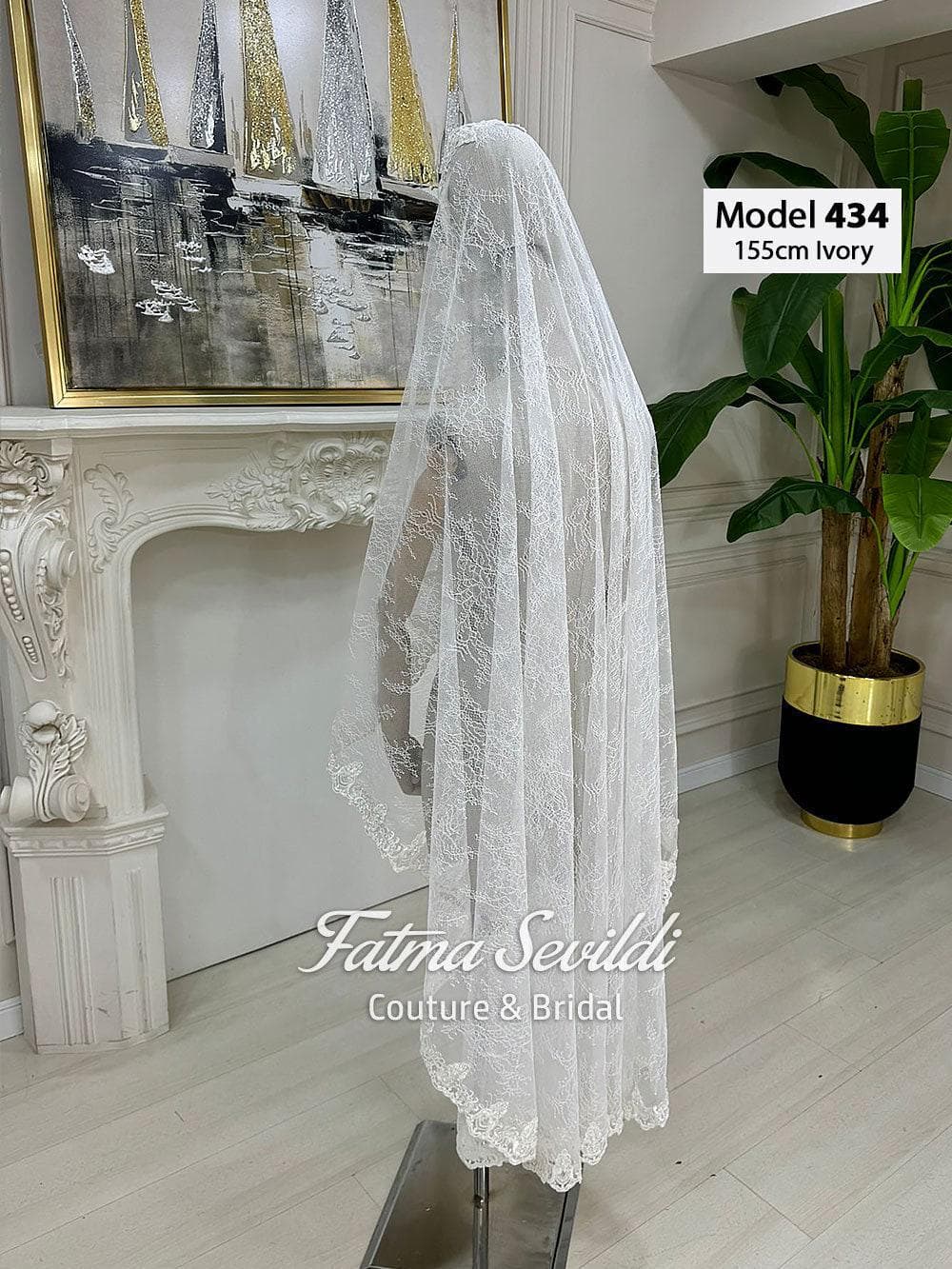 Short beaded lace bridal veil in soft ivory tulle with elegant lace edging, designed in fingertip to waltz length for classic and modest bridal styling. Hijab-friendly wedding veil option with refined detail for a timeless bridal look.