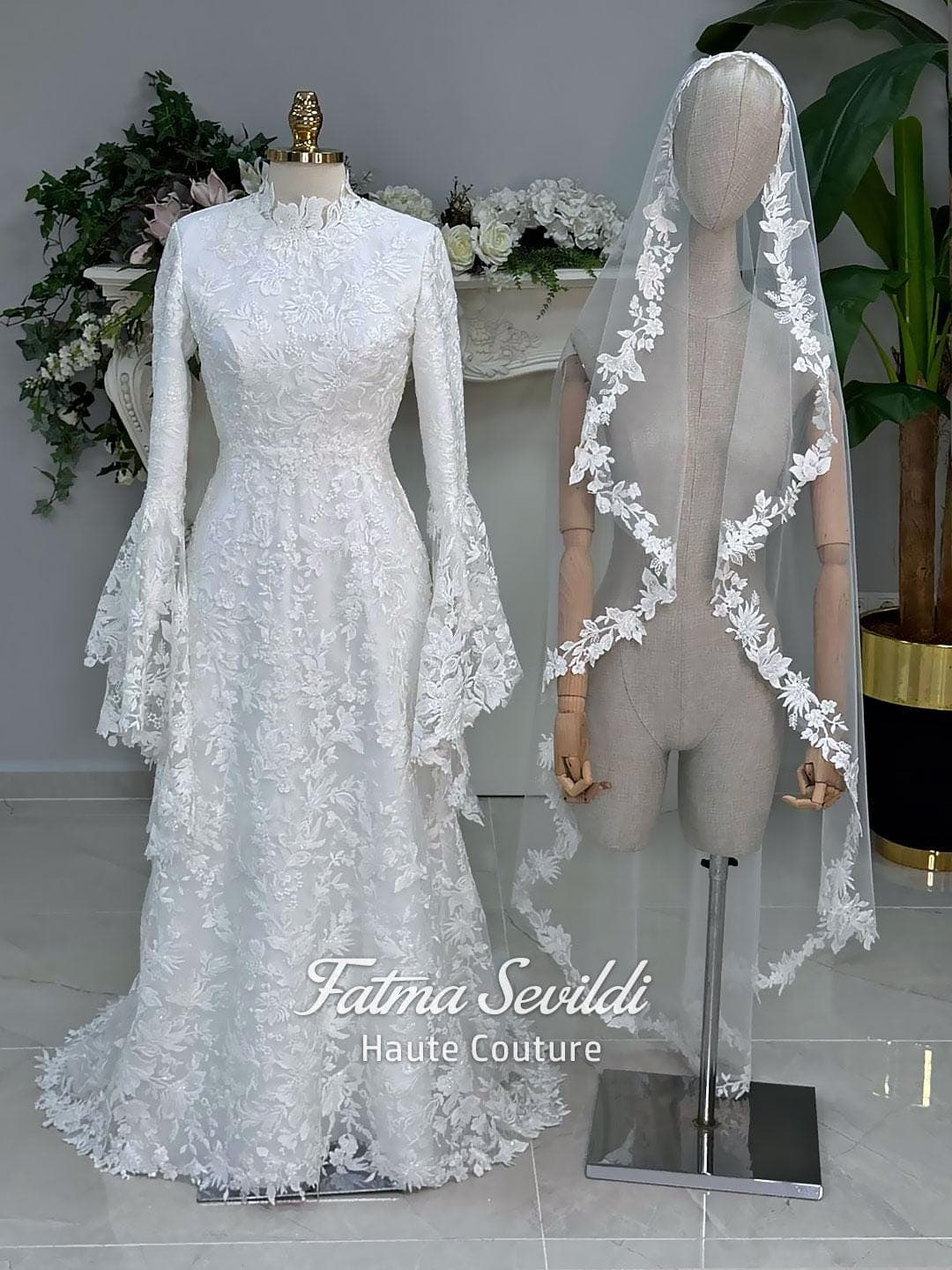 Veiled hijab wedding dress with high neck, long sleeves, and beaded floral lace in an elegant A-line couture silhouette.