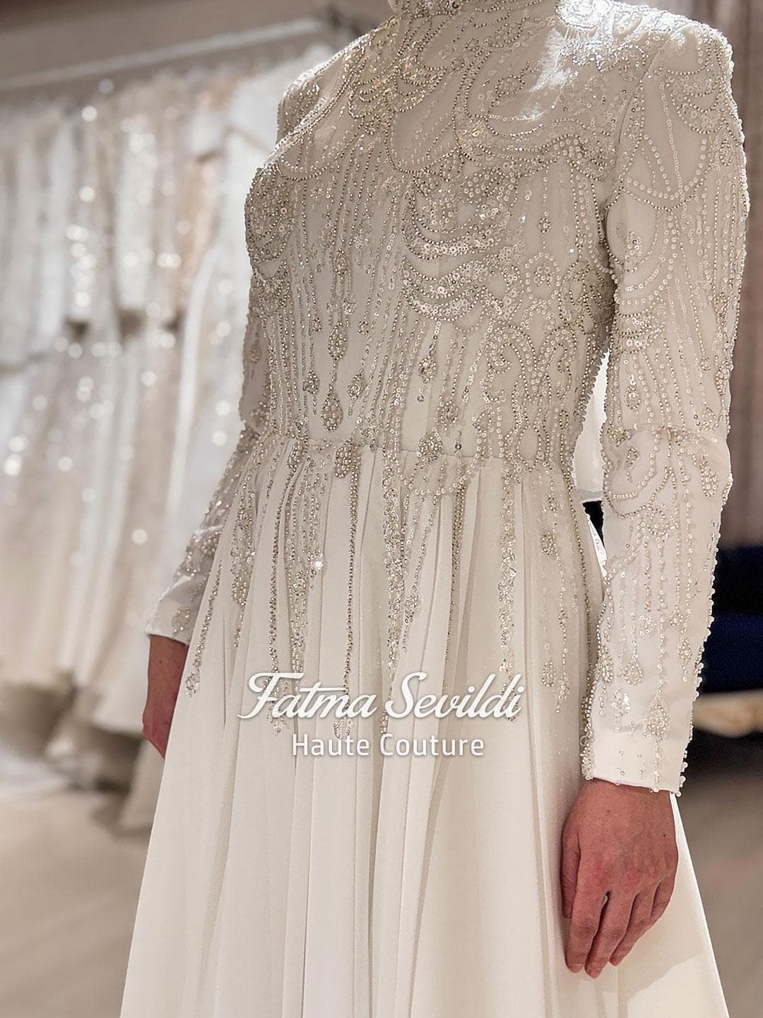 Luxury hijab wedding dress with beaded lace, high neck and long sleeves in a modest A-line silhouette, custom made for elegant Muslim bridal coverage. Sparkling couture beadwork on satin and tulle for a refined finish.