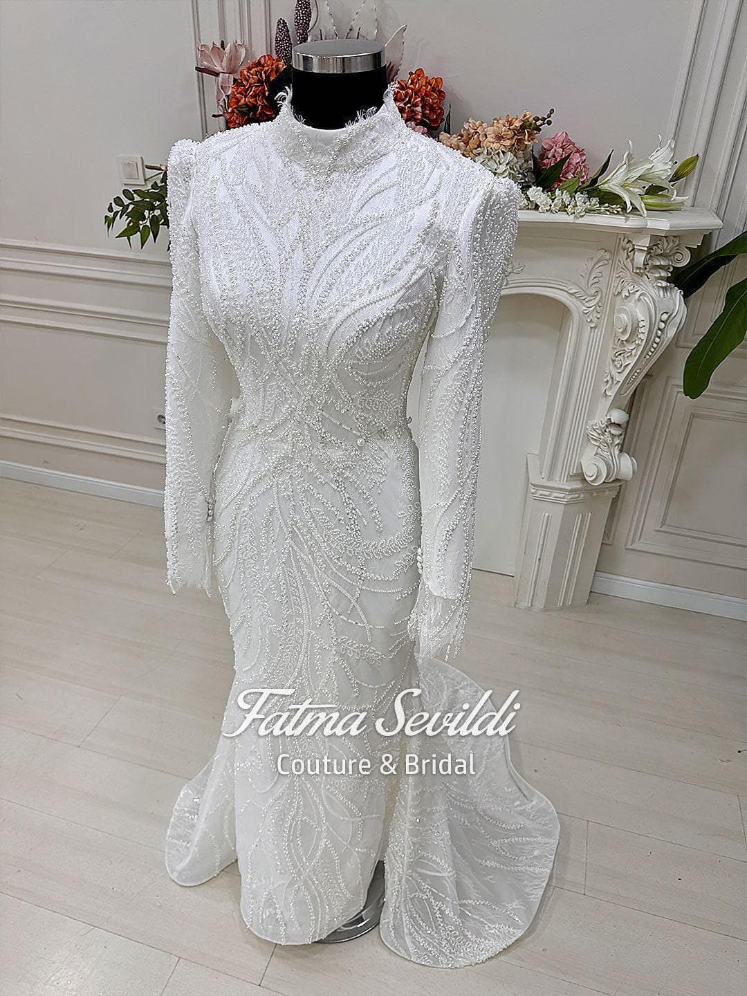 Veiled hijab wedding dress in a modest mermaid silhouette with detachable skirt and hand-beaded lace, made to measure for luxury coverage. Includes a premium lace veil for a complete couture bridal set.
