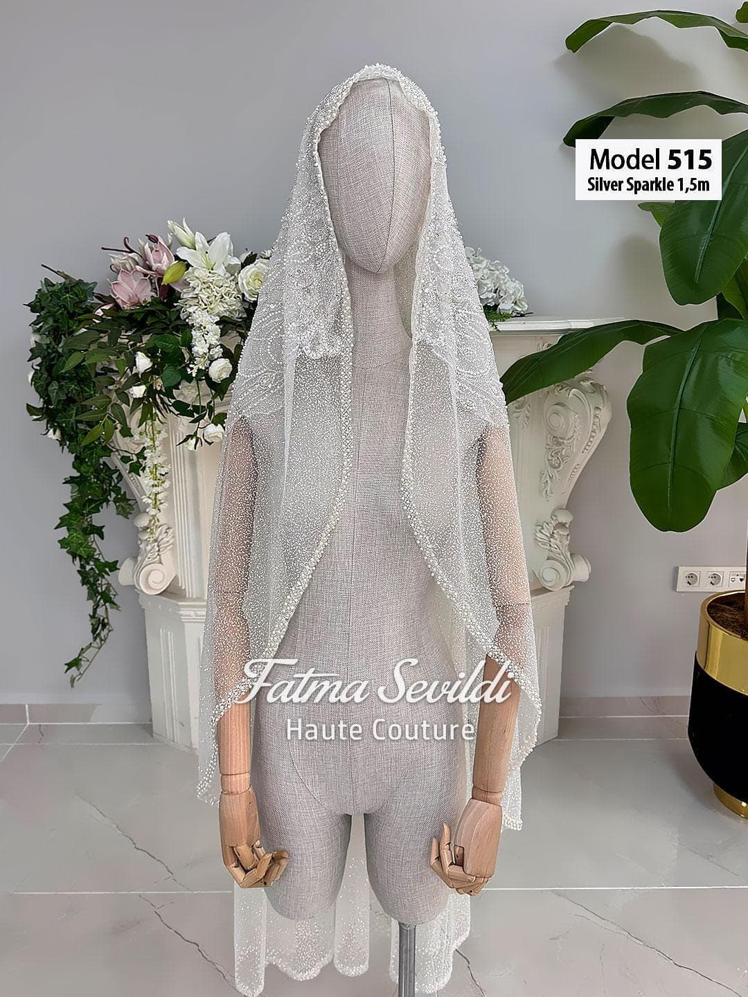 Beaded lace bridal veil in soft ivory tulle with elegant waltz to chapel length, designed for classic and modest bridal styling. Hijab-friendly wedding veil with refined lace edging and hand-finished detail for a timeless bridal look.