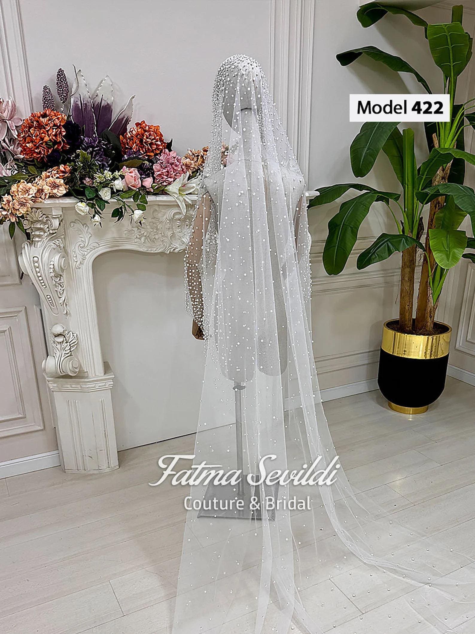 Pearl lace cathedral bridal veil in soft ivory tulle with hand-sewn beaded appliqué, designed for elegant classic and modest bridal styling. Hijab-friendly long wedding veil with refined lace detail and a timeless couture finish.