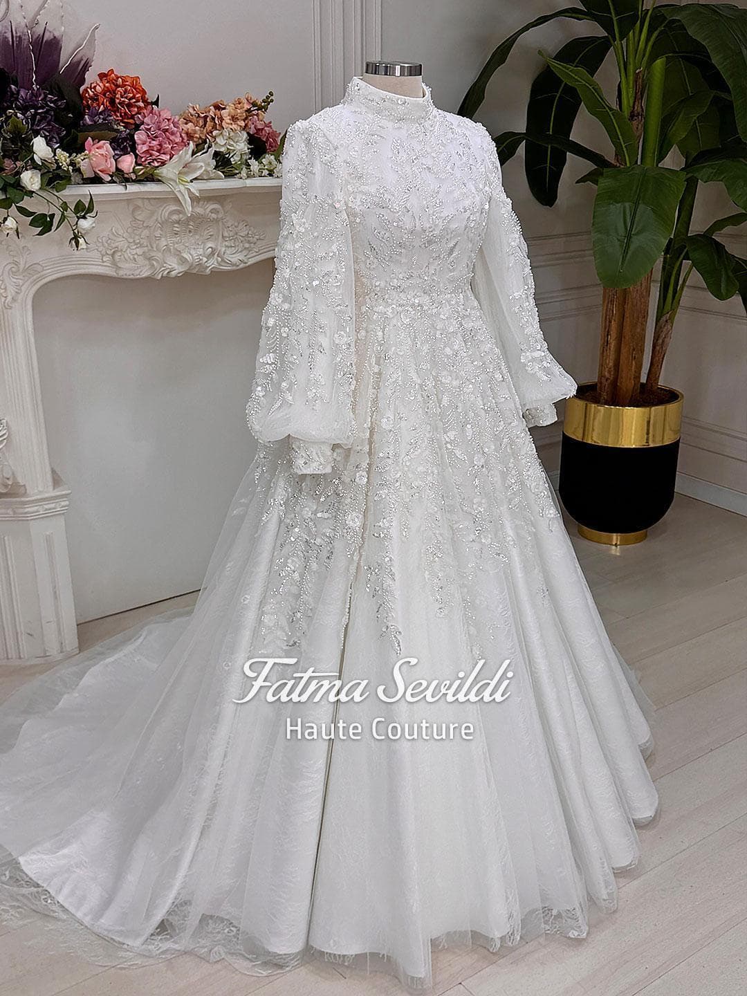 Veiled hijab wedding dress with high neck, long sleeves, and luxury beaded lace in a couture ball gown silhouette. Includes premium lace veil, headscarf, and petticoat.