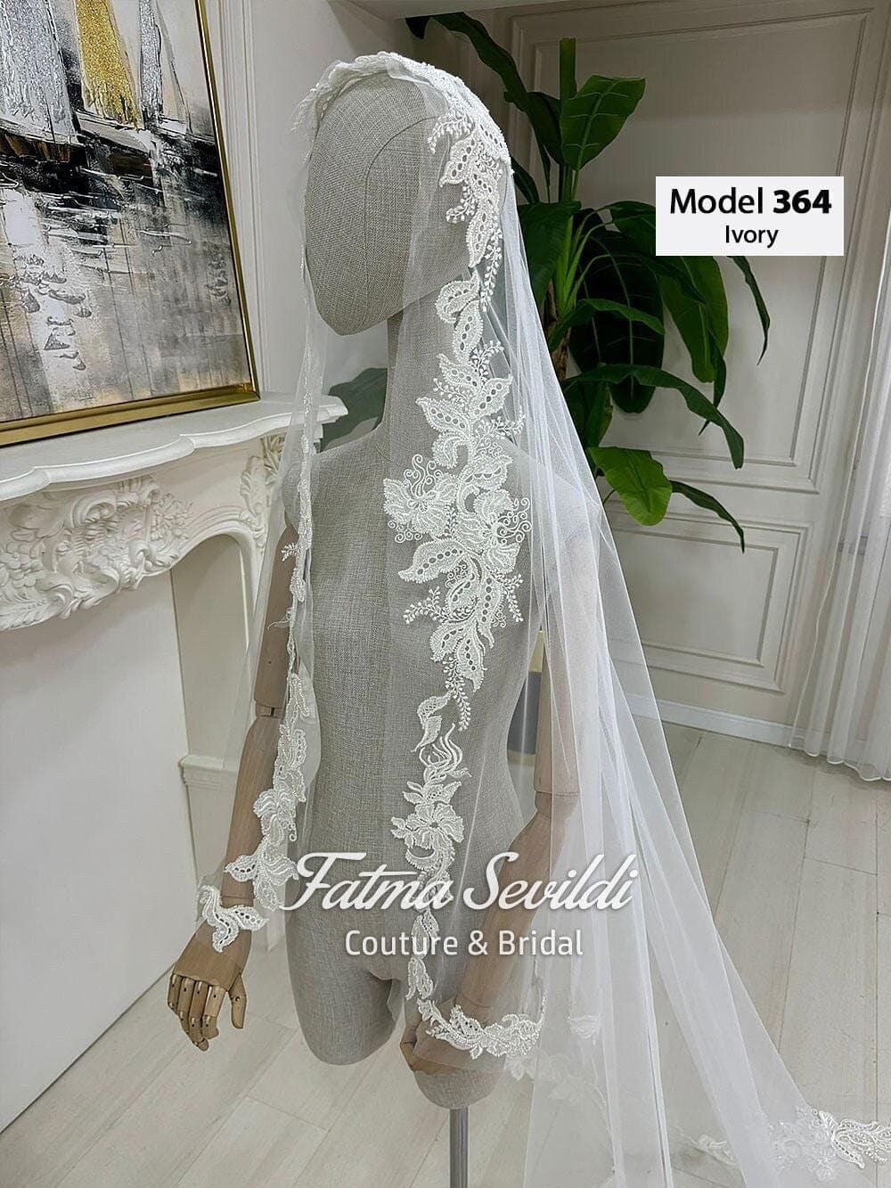 Veiled beaded lace-edge cathedral bridal veil on soft premium tulle, designed for hijab-friendly modest wedding styling. Hand-sewn lace motifs for a couture drape and elegant movement.