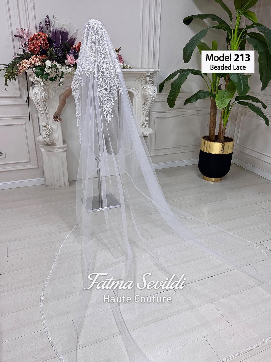 Hand-beaded lace cathedral bridal veil in soft ivory tulle, styled for elegant modest bridal wear with a hijab-friendly option. Long lace edge wedding veil with romantic drape and couture bridal detail.