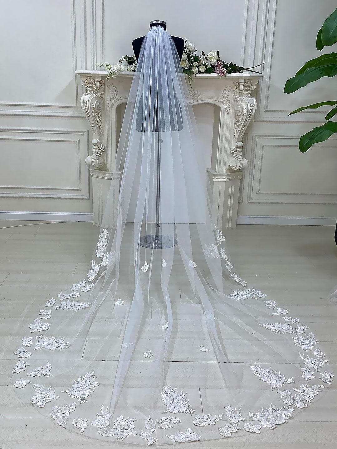 Luxury veiled hijab wedding dress with beaded lace, long sleeves, full coverage bodice, and elegant A-line bridal silhouette. Modest Muslim wedding gown with custom couture detailing and romantic lace veil.