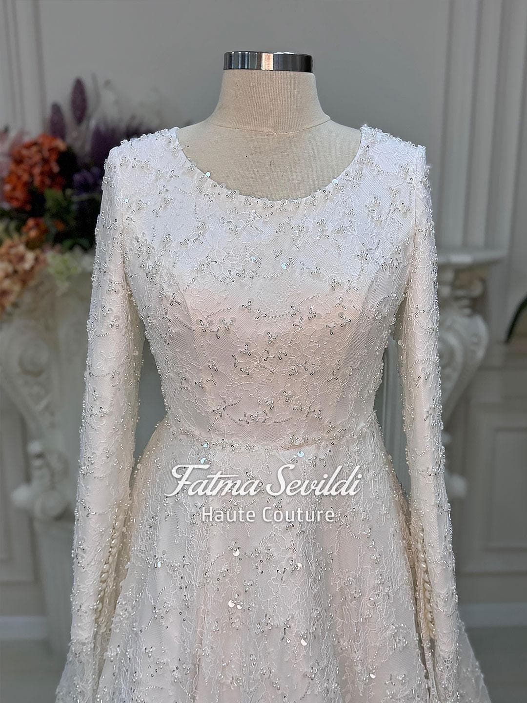 Veiled hijab wedding dress with full beaded lace, long sleeves and an elegant A-line silhouette, custom made for luxury modest bridal coverage. Includes a premium lace veil for a complete Muslim bridal set.