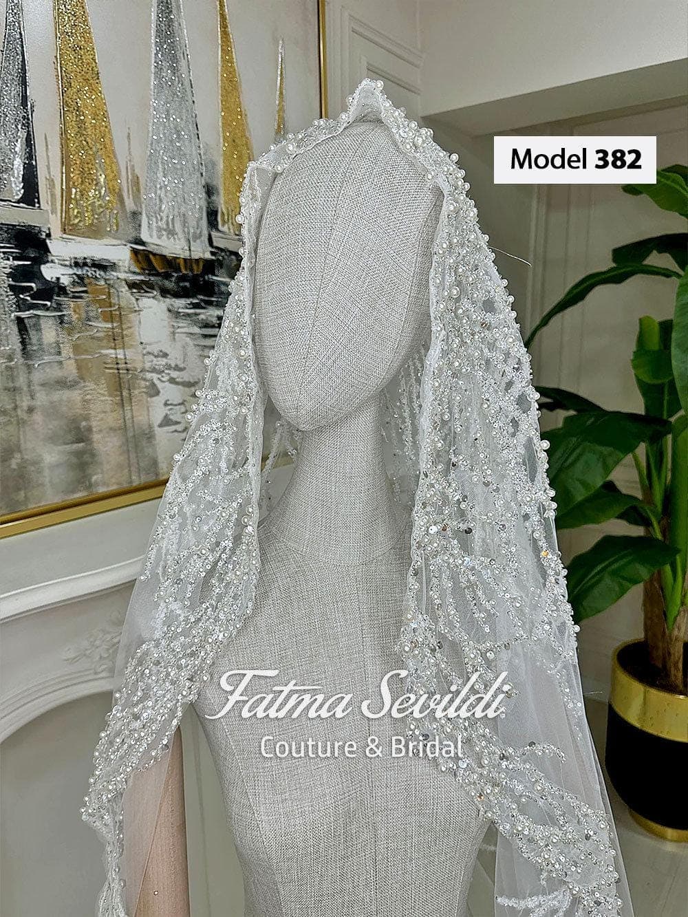 Beaded lace mantilla bridal veil in soft ivory tulle with cathedral-length drape, designed for elegant wedding styling and modest hijab-friendly wear. Long lace edge wedding veil with refined hand-finished detail and timeless bridal coverage.