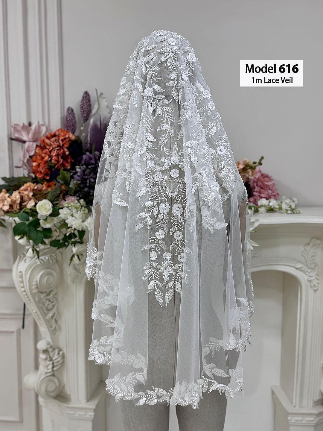 Beaded lace bridal veil in soft ivory tulle with elegant waltz to chapel length, designed for classic and modest bridal styling. Hijab-friendly wedding veil with refined lace edging and hand-finished detail for a timeless bridal look.