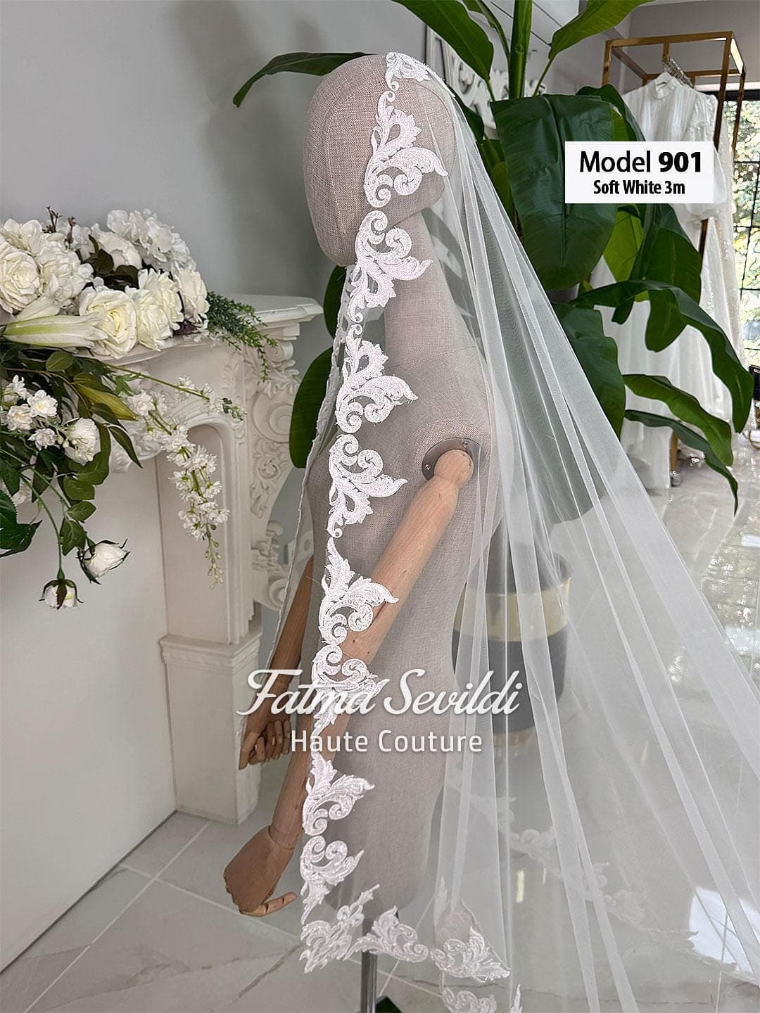 Hand-sewn beaded lace cathedral wedding veil in soft ivory tulle, designed for elegant classic and modest bridal styling. Hijab-friendly long bridal veil with refined lace detail, graceful drape, and a timeless couture finish.