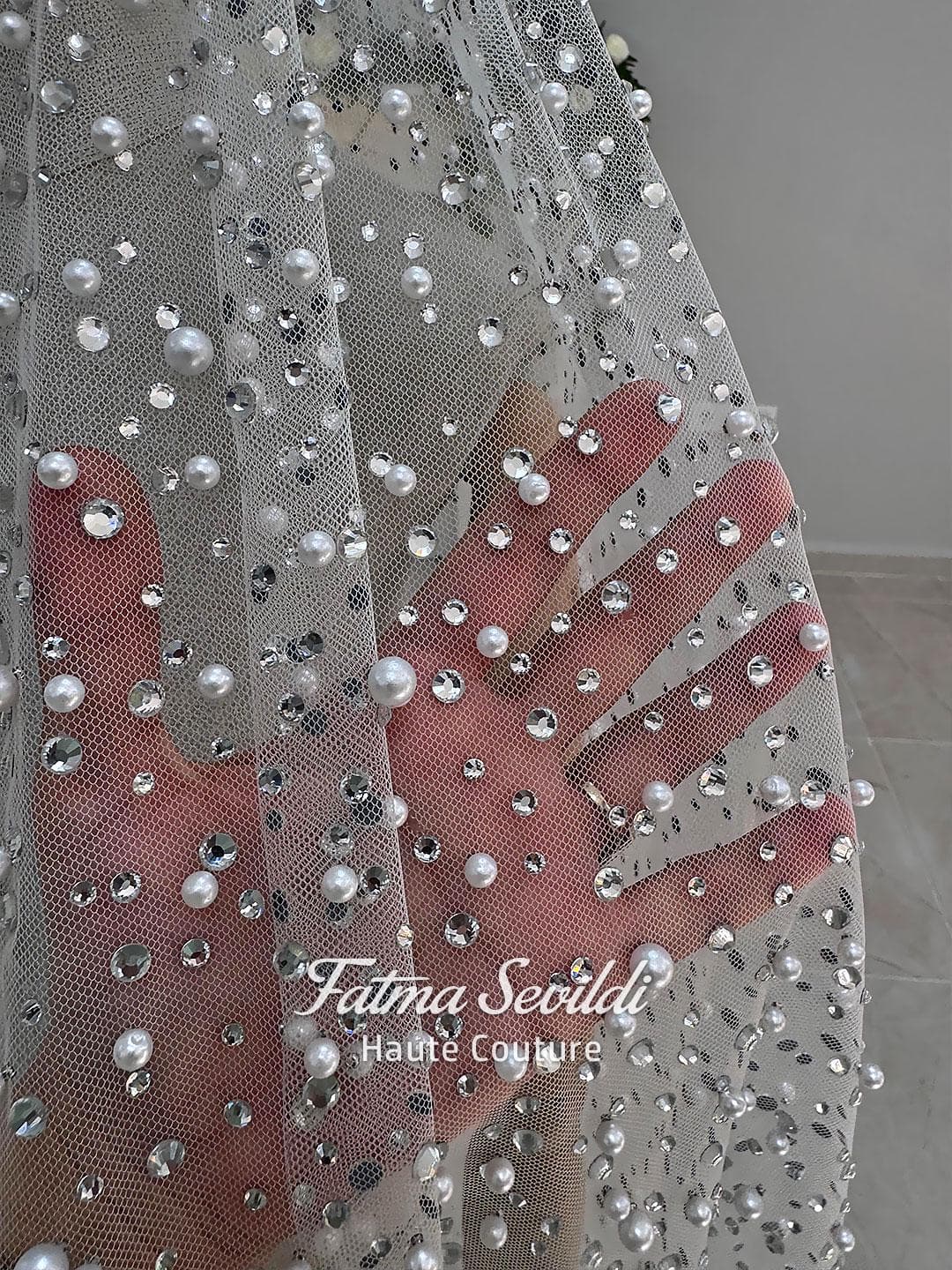 Hijab wedding veil made of cathedral-length tulle, embellished with pearls and silver crystals for a luxury modest bridal look. Shown from front, back, and close-up to highlight the sparkle and detailed beading.