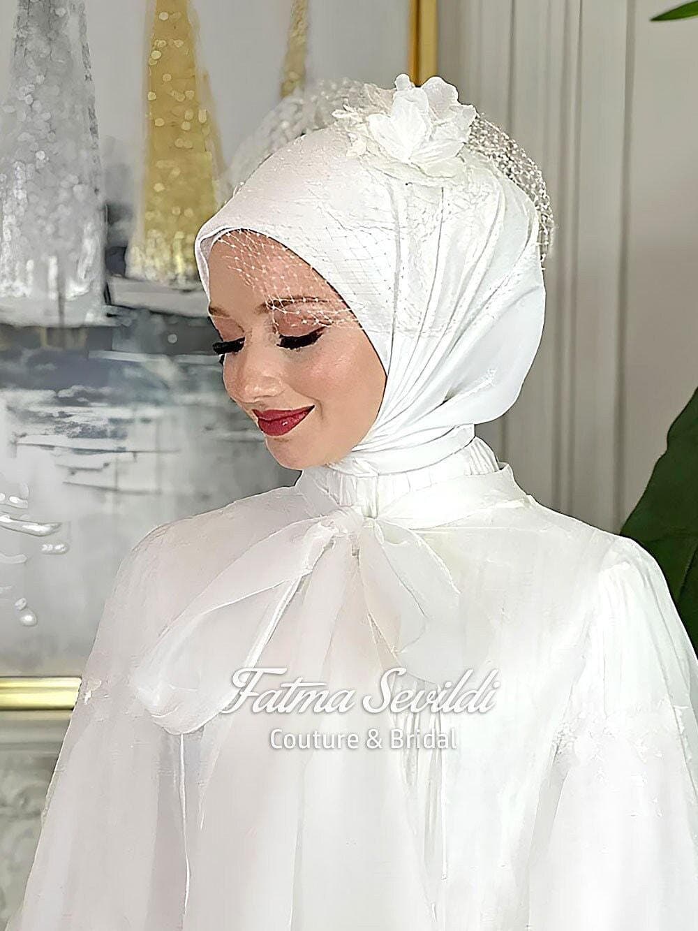 Bridal hijab headscarf in soft matte satin, photo-ready with no shine or glare, designed for elegant modest wedding styling. Available in white or ivory with optional hijab head set.