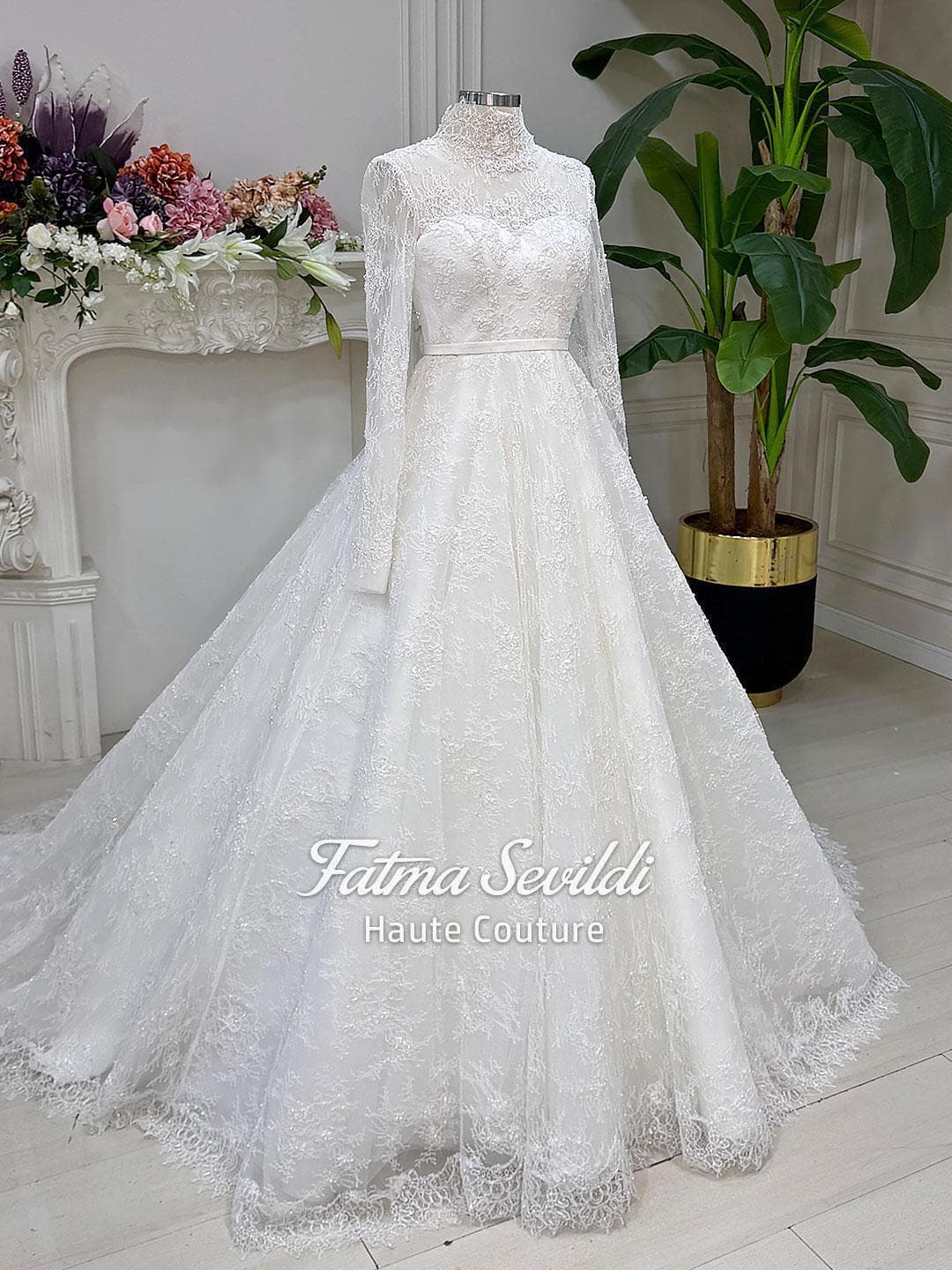 Veiled bridal set featuring a strapless beaded lace ballgown with corset back and full skirt volume, made to measure. Includes premium lace veil, headscarf, and petticoat for a couture wedding look.