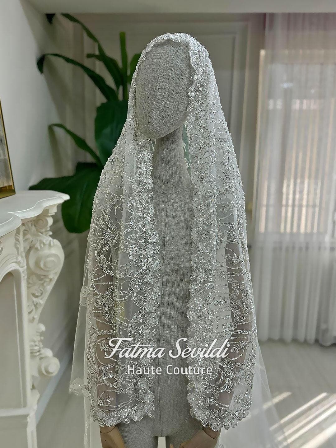 Hijab wedding veil with shimmering beaded lace embroidery and cathedral-length tulle train, designed for a modest bridal look with a luxury finish. Close-up views show the lace edge detail and elegant drape.