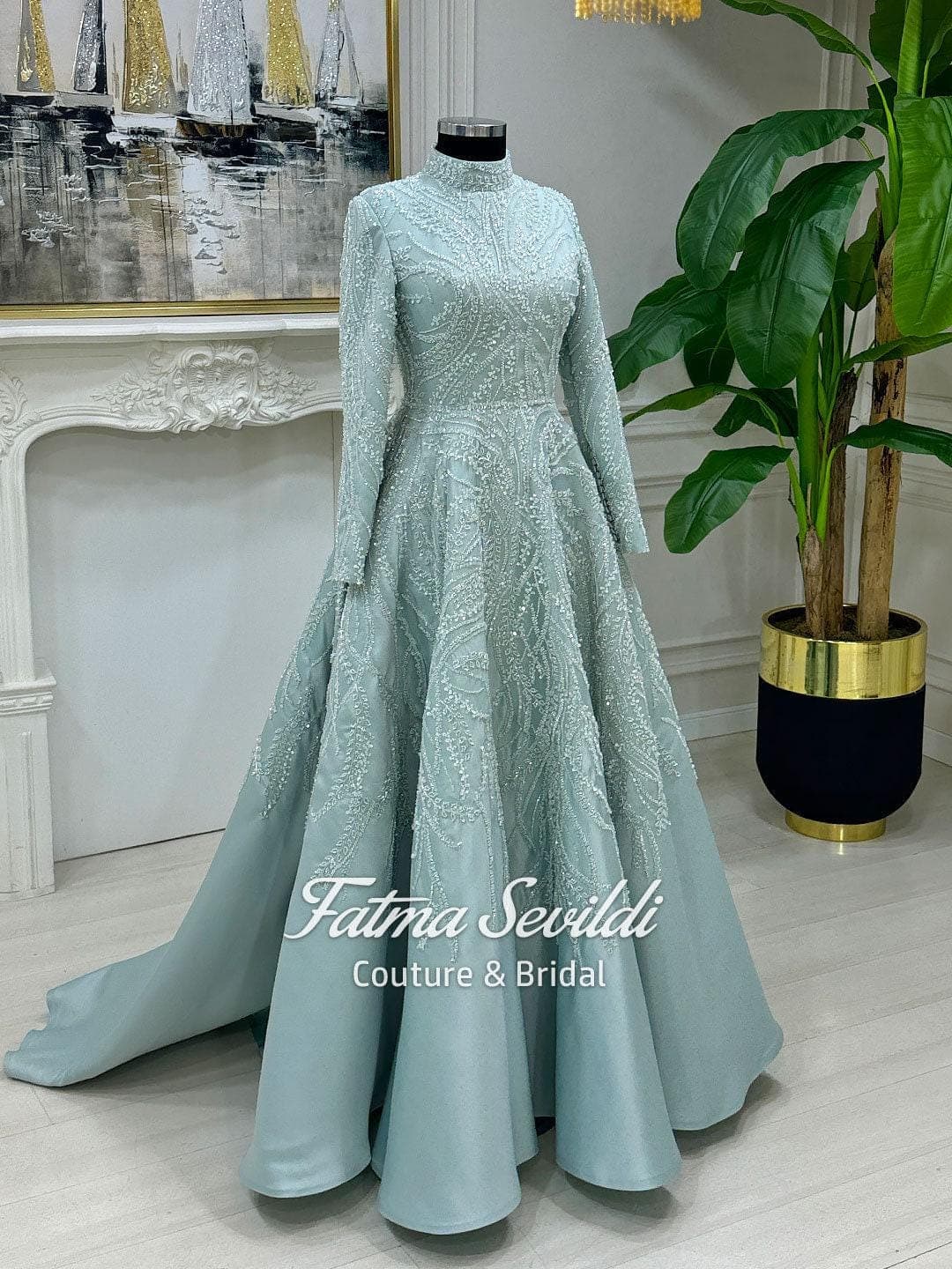 Caped hijab evening gown with high neck, long sleeves, and shimmering beaded lace in a full ballgown silhouette. Elegant modest formal dress custom made to measurements.