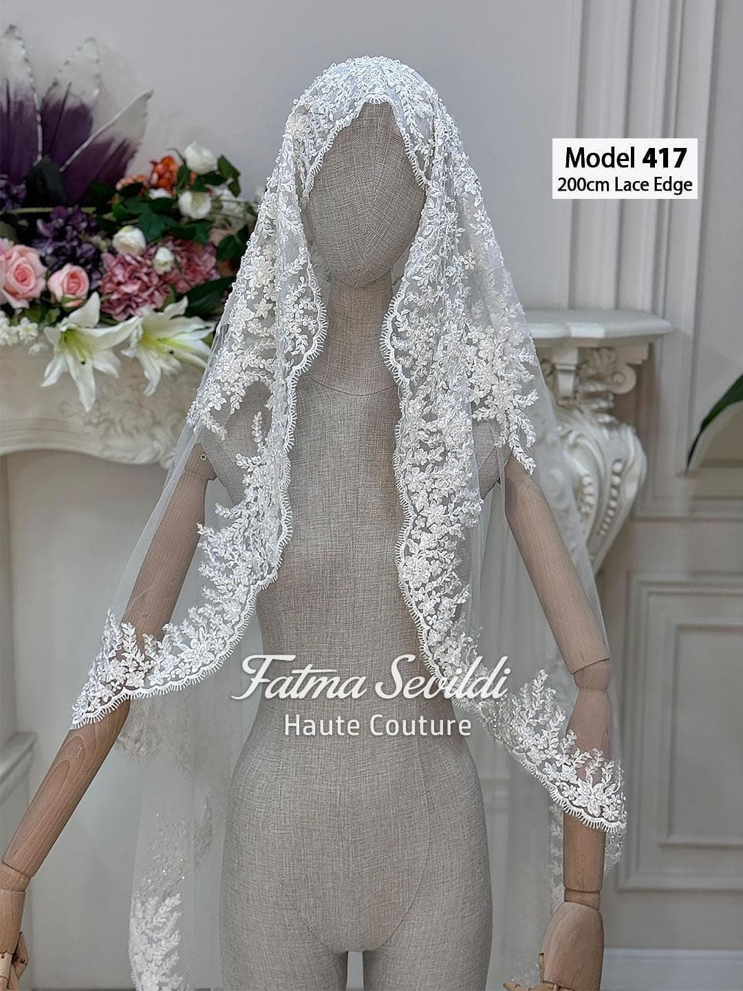 Beaded lace edge cathedral wedding veil in luxury tulle with hand-sewn lace appliqué, hijab-friendly option. Elegant mantilla-inspired bridal veil for modest and classic wedding looks.