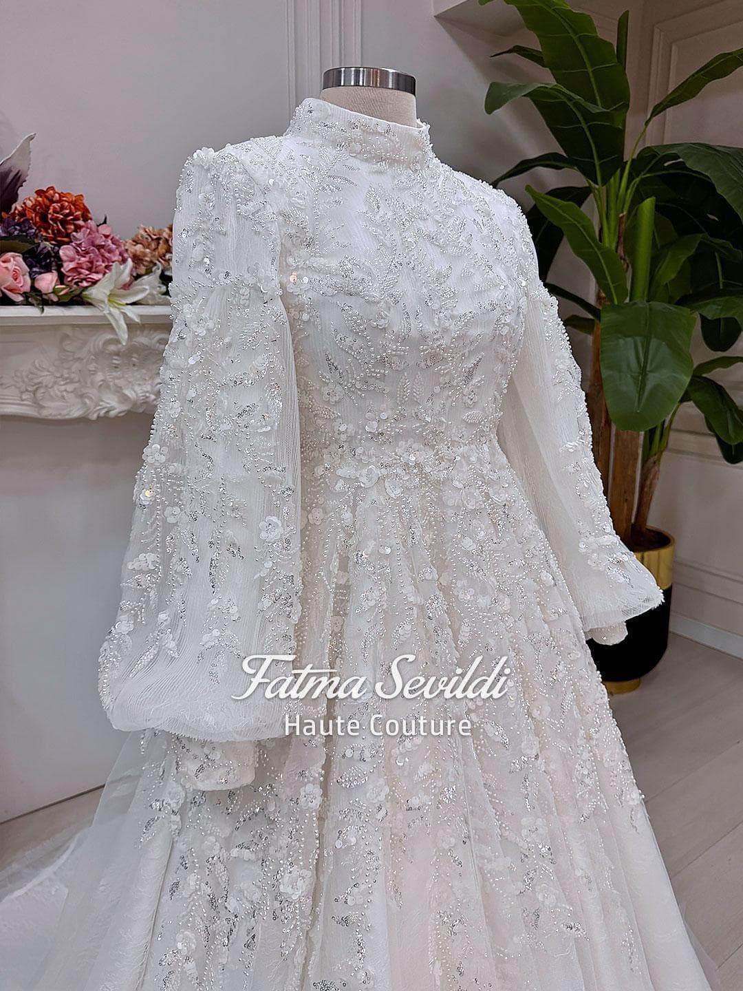 Veiled hijab wedding dress with high neck, long sleeves, and luxury beaded lace in a couture ball gown silhouette. Includes premium lace veil, headscarf, and petticoat.