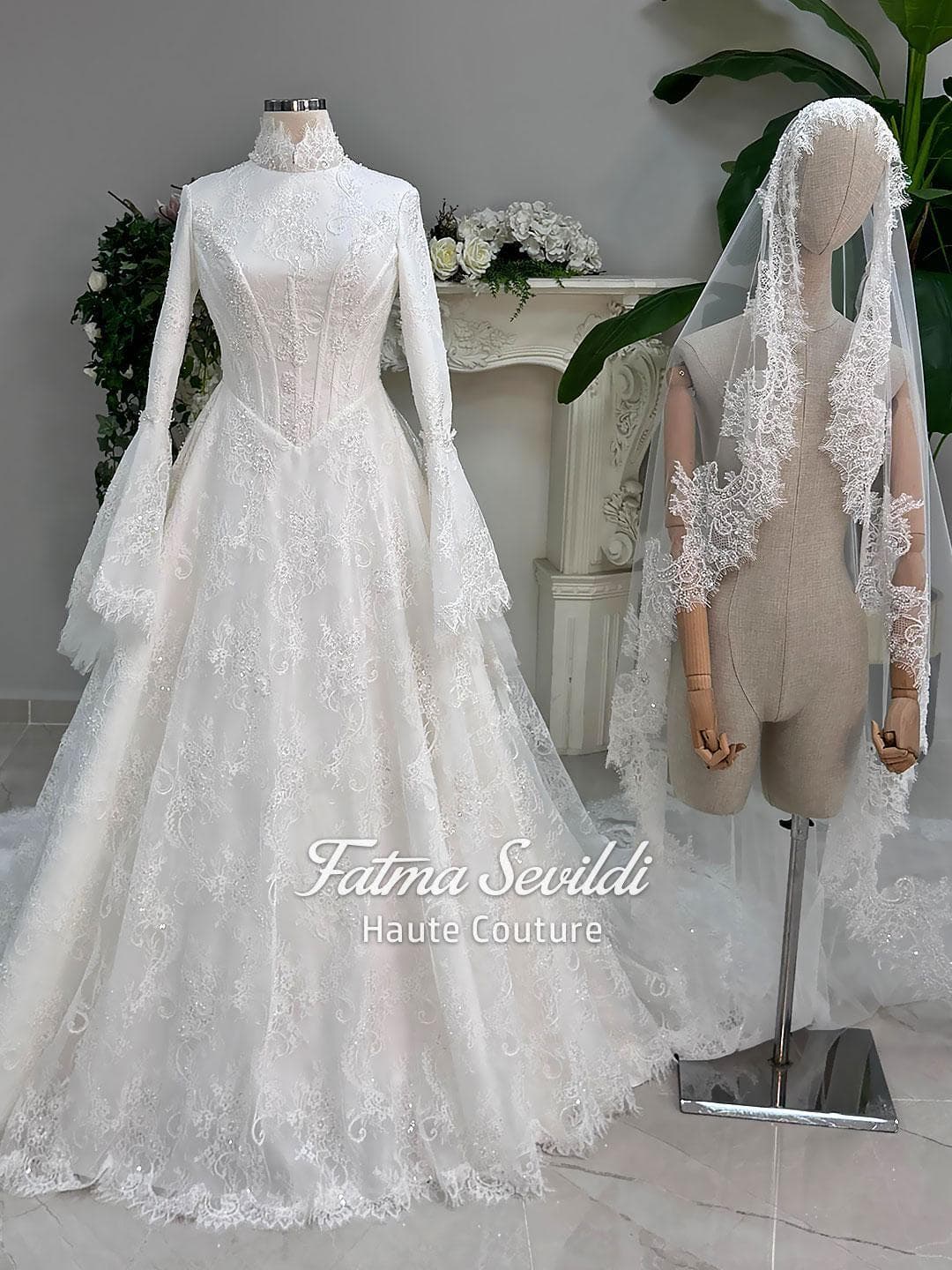 Veiled hijab wedding dress with corset bodice, bell sleeves, and beaded lace in an elegant A-line silhouette. Premium lace veil included for a complete modest bridal set.