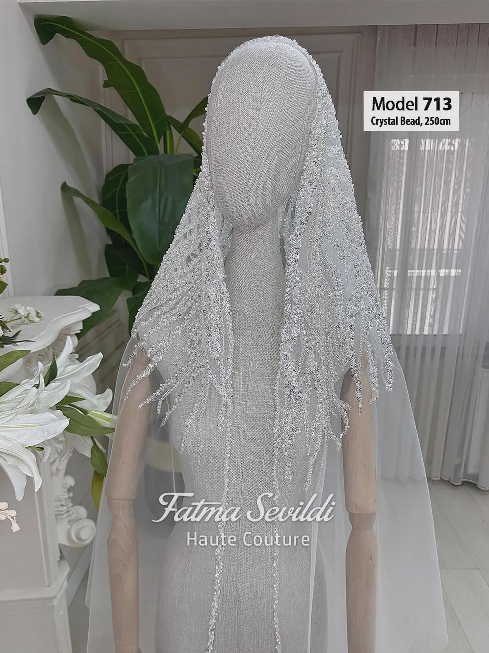 Hand-beaded lace cathedral bridal veil in soft ivory tulle, styled for elegant modest bridal wear with a hijab-friendly option. Long lace edge wedding veil with romantic drape and couture bridal detail.