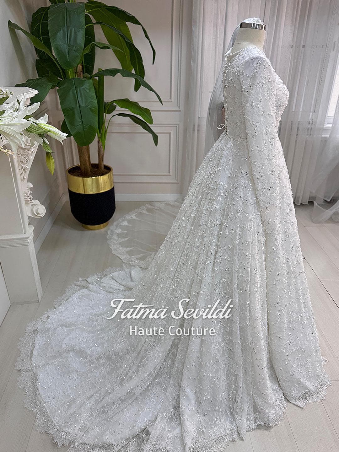 Veiled hijab wedding dress with full beaded lace, long sleeves and an elegant A-line silhouette, custom made for luxury modest bridal coverage. Includes a premium lace veil for a complete Muslim bridal set.